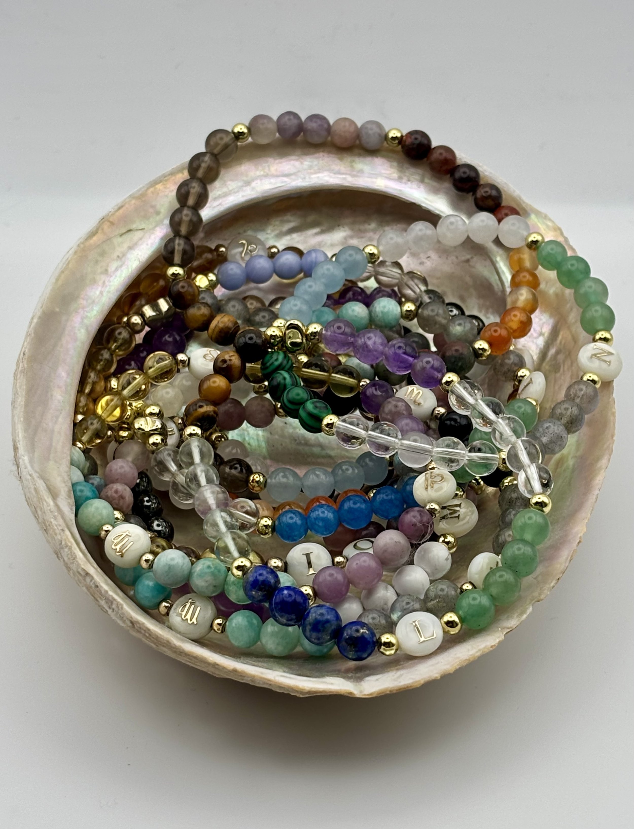 Colorful beaded bracelets inside a polished shell