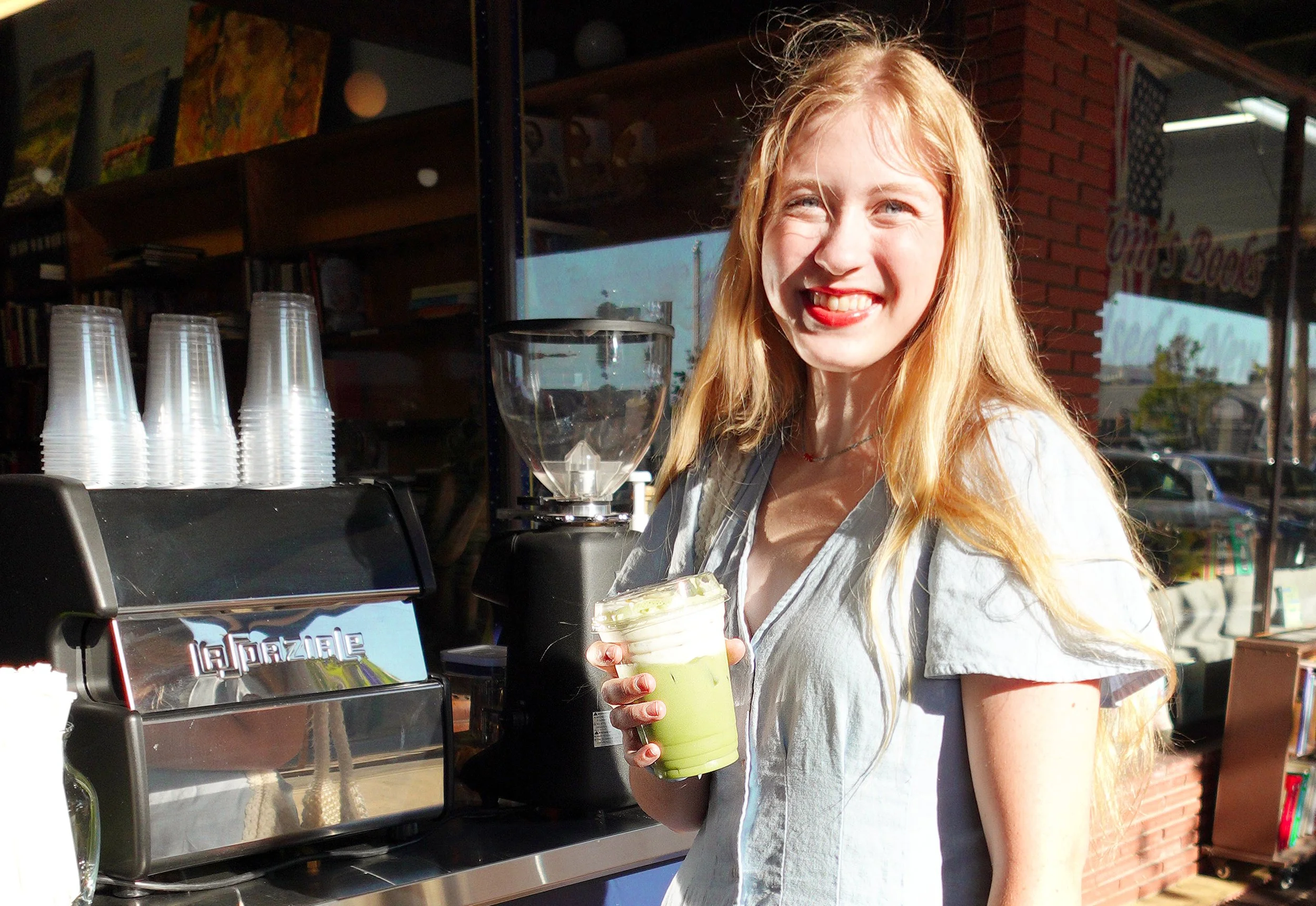 Coffee Cart & Espresso Bar client with iced matcha latte and espresso drink.jpg