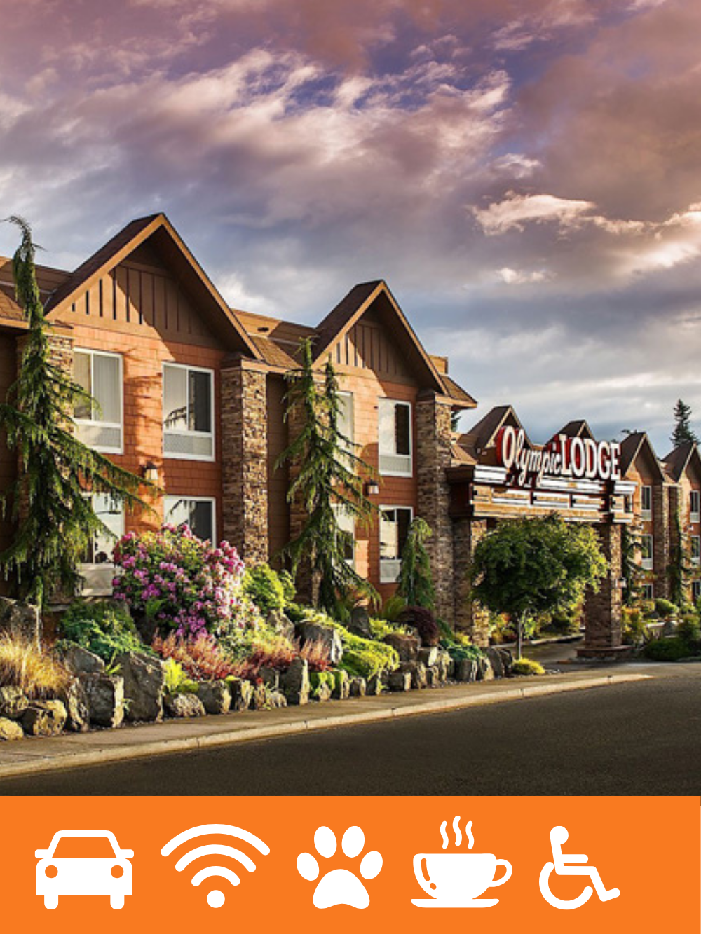 Exterior view of a lodge with stone and wood siding, surrounded by landscaped gardens and trees, under a partly cloudy sky.