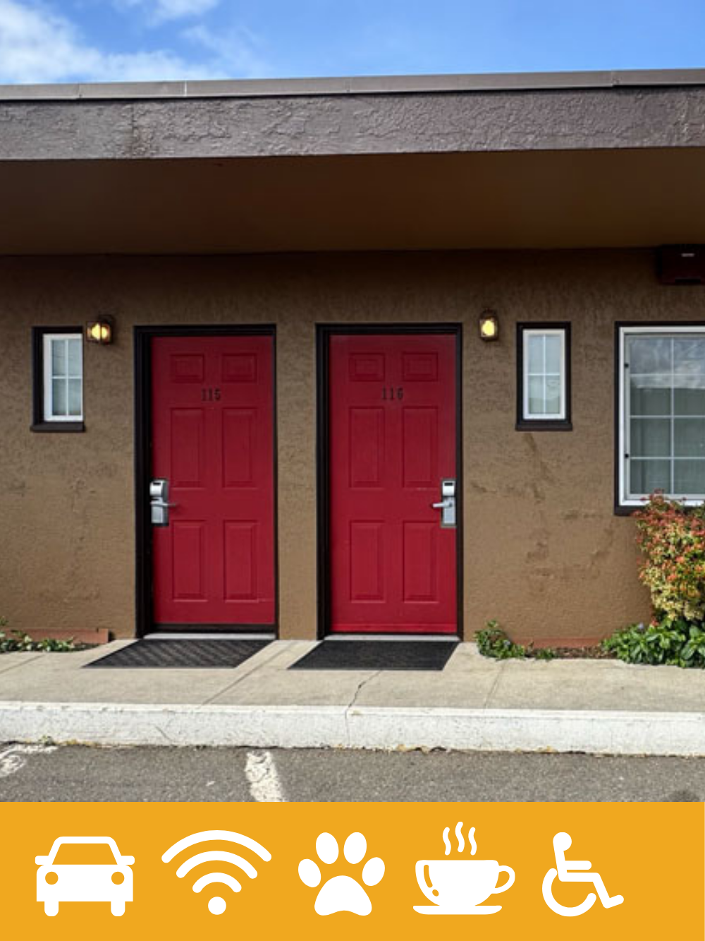 Two red doors marked 115 and 116 on a beige apartment building exterior with small windows, outdoor lights, and some bushes, under a partly cloudy sky.