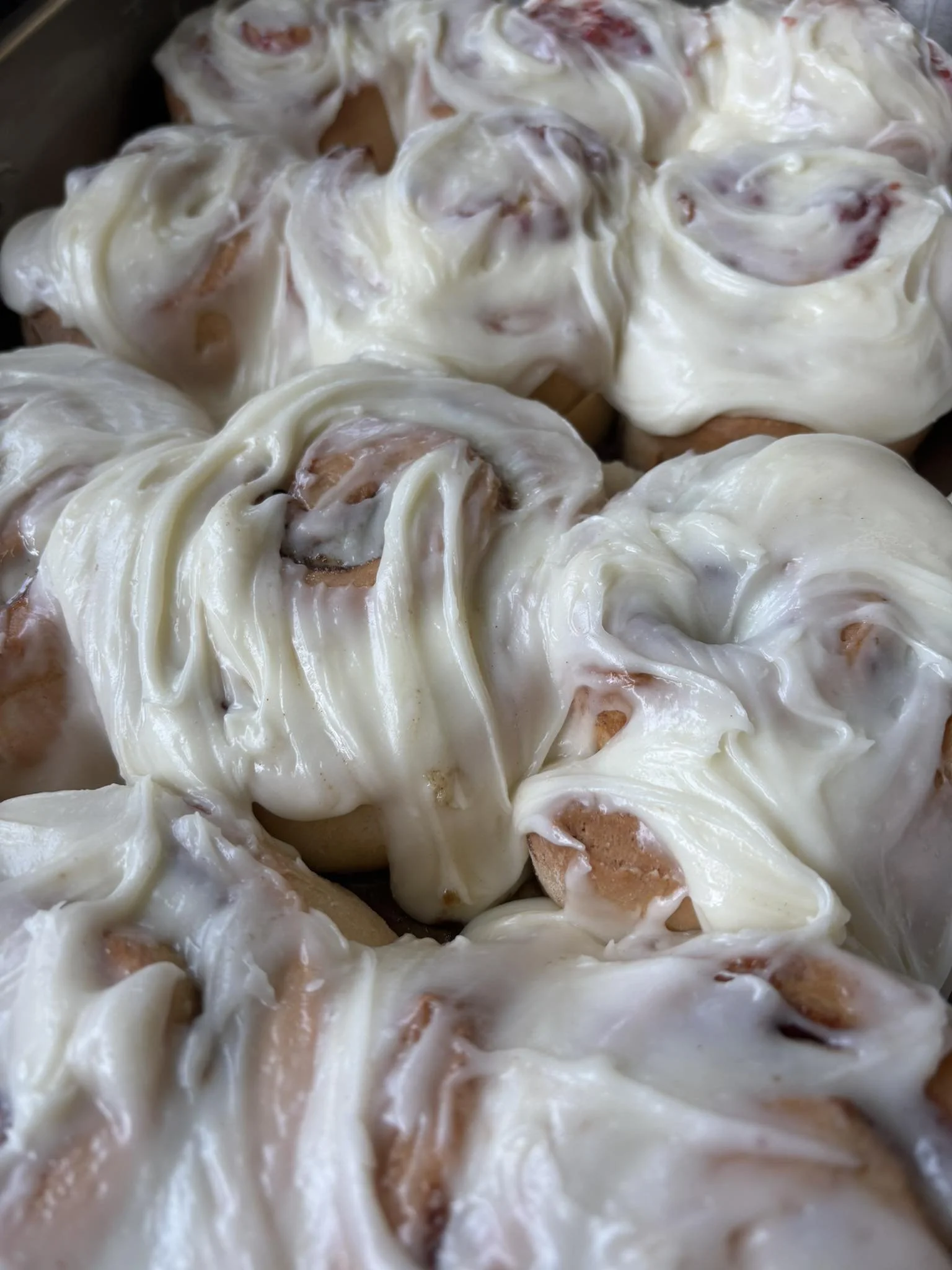 Closeup of cinnamon rolls in a pan