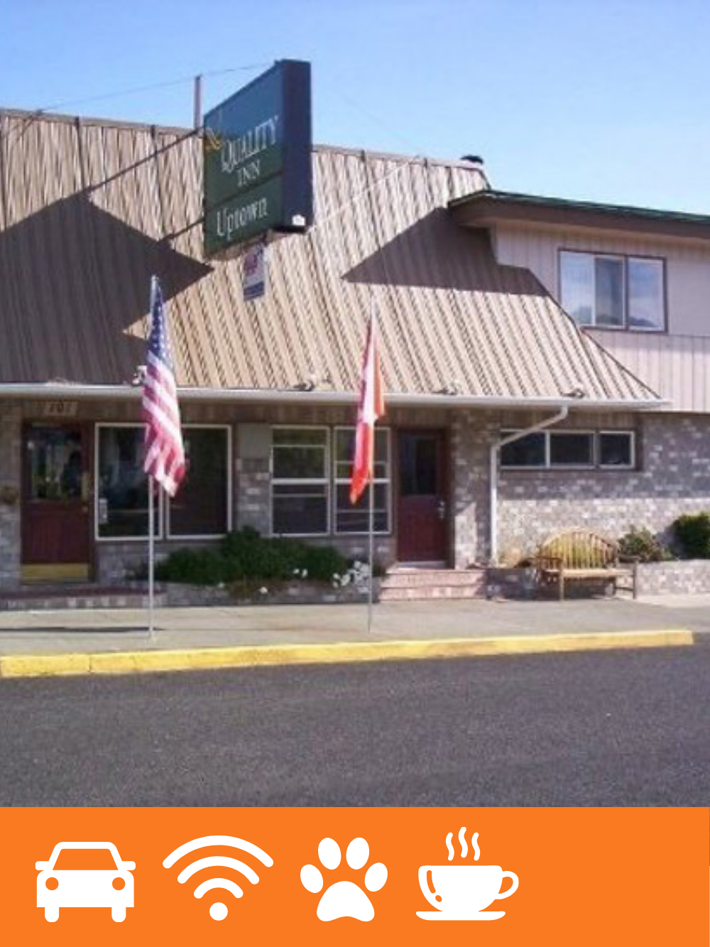 A building with a sign that reads 'Solace Inn Lounge', two flags in front (American flag and Canadian flag), and a bench outside.
