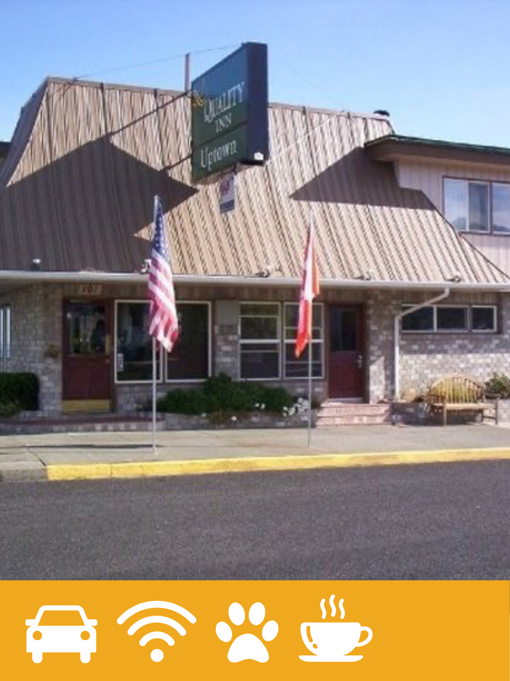 A building with a sign that reads 'Solace Inn Lounge', two flags in front (American flag and Canadian flag), and a bench outside.