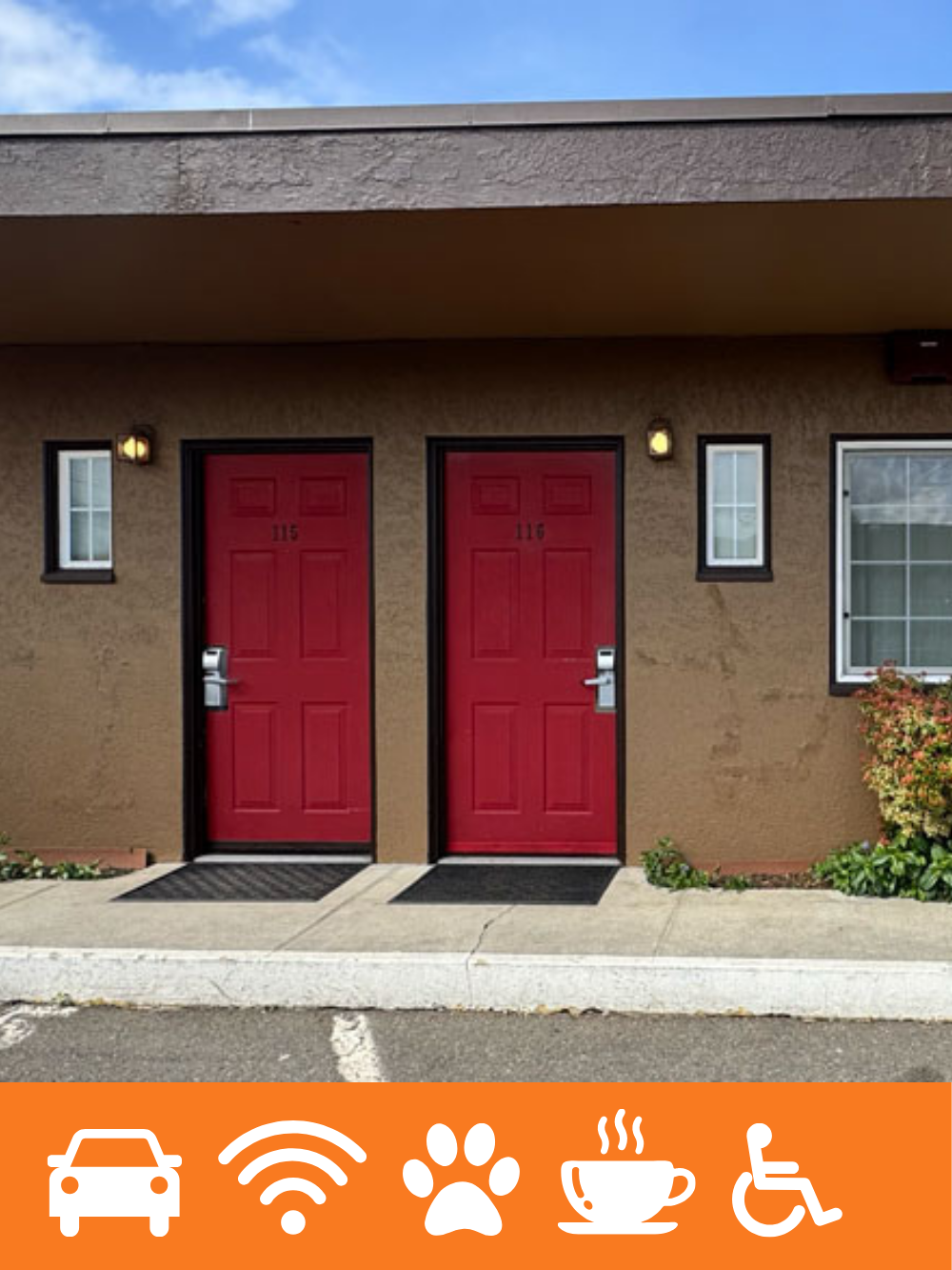 Two red doors marked 115 and 116 on a beige apartment building exterior with small windows, outdoor lights, and some bushes, under a partly cloudy sky.