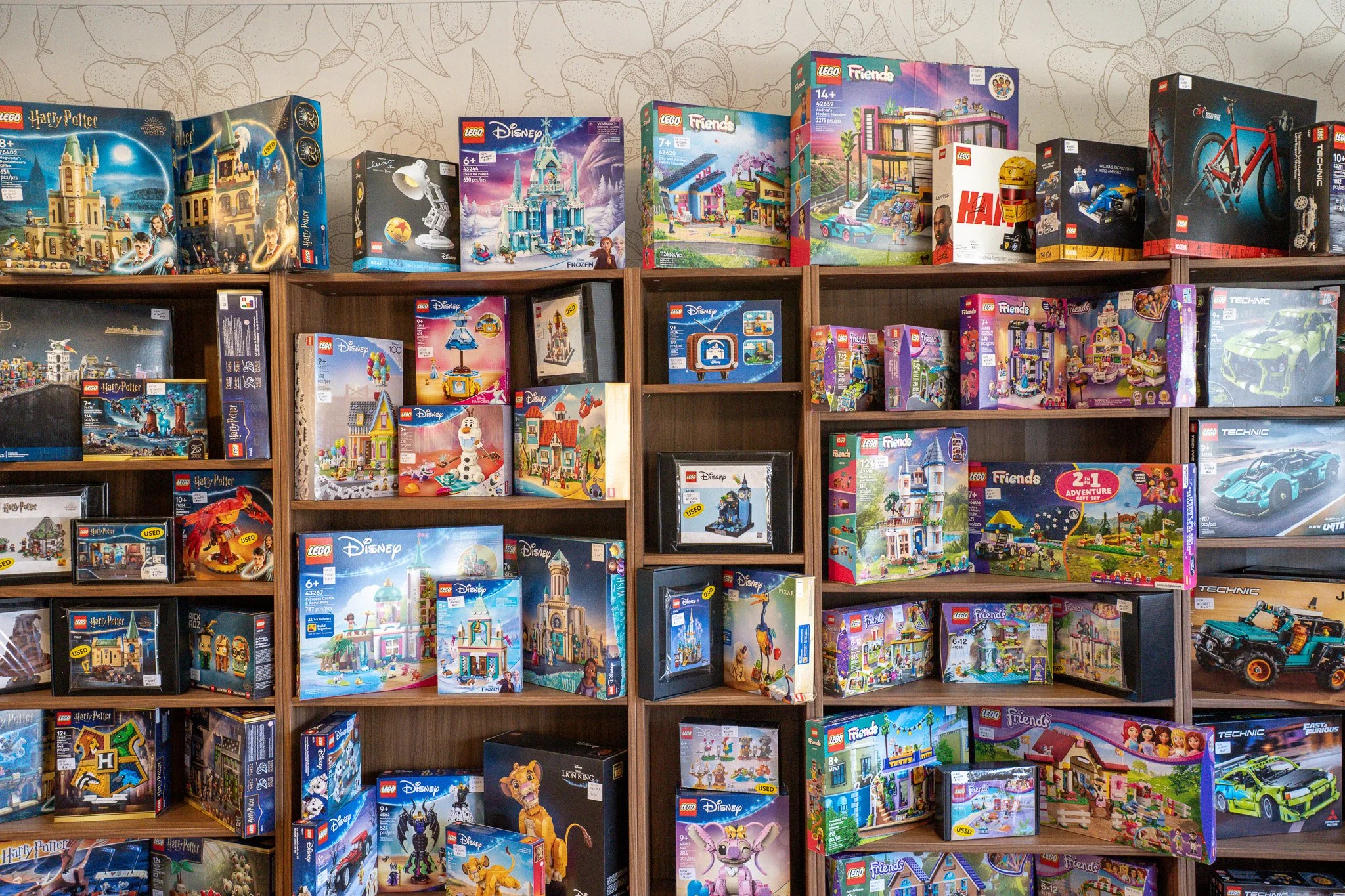 Stacks of Lego sets on shelf displays inside Olympic Bricks located in Port Angeles.