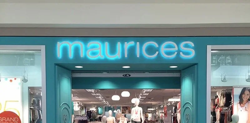 Storefront for Maurices clothing store with a bright blue sign and entrance