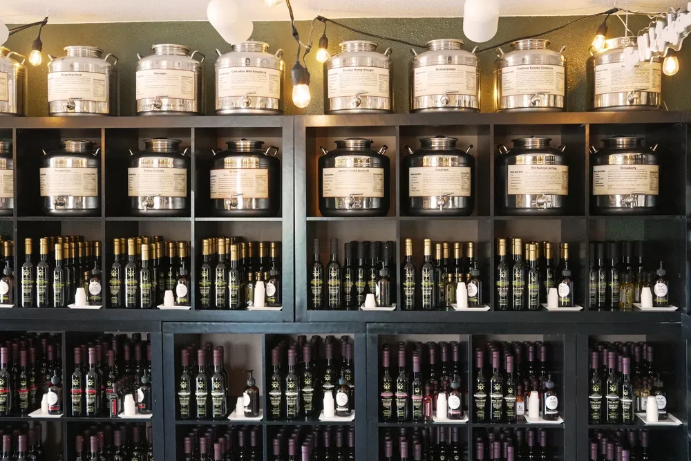 A wall of olive oil bottles display inside the Fog Horn Tasting Room in Port Angeles
