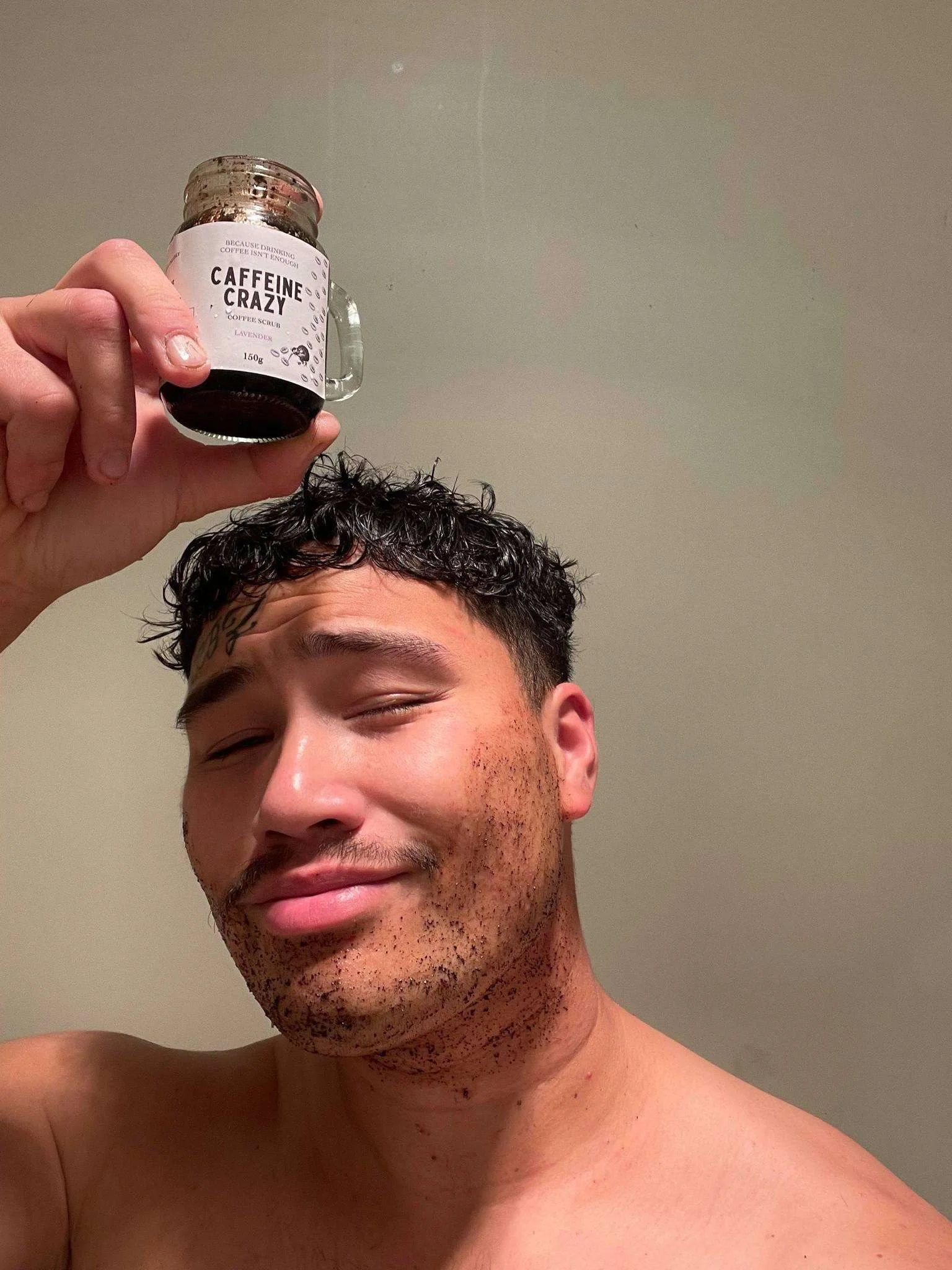 Male in Aotearoa New Zealand enjoying all-natural coffee scrub handcrafted in Marlborough.