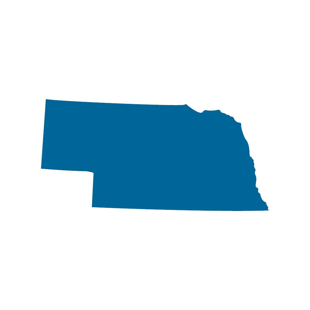 Blue silhouette outline of the state of Nebraska on a white background.