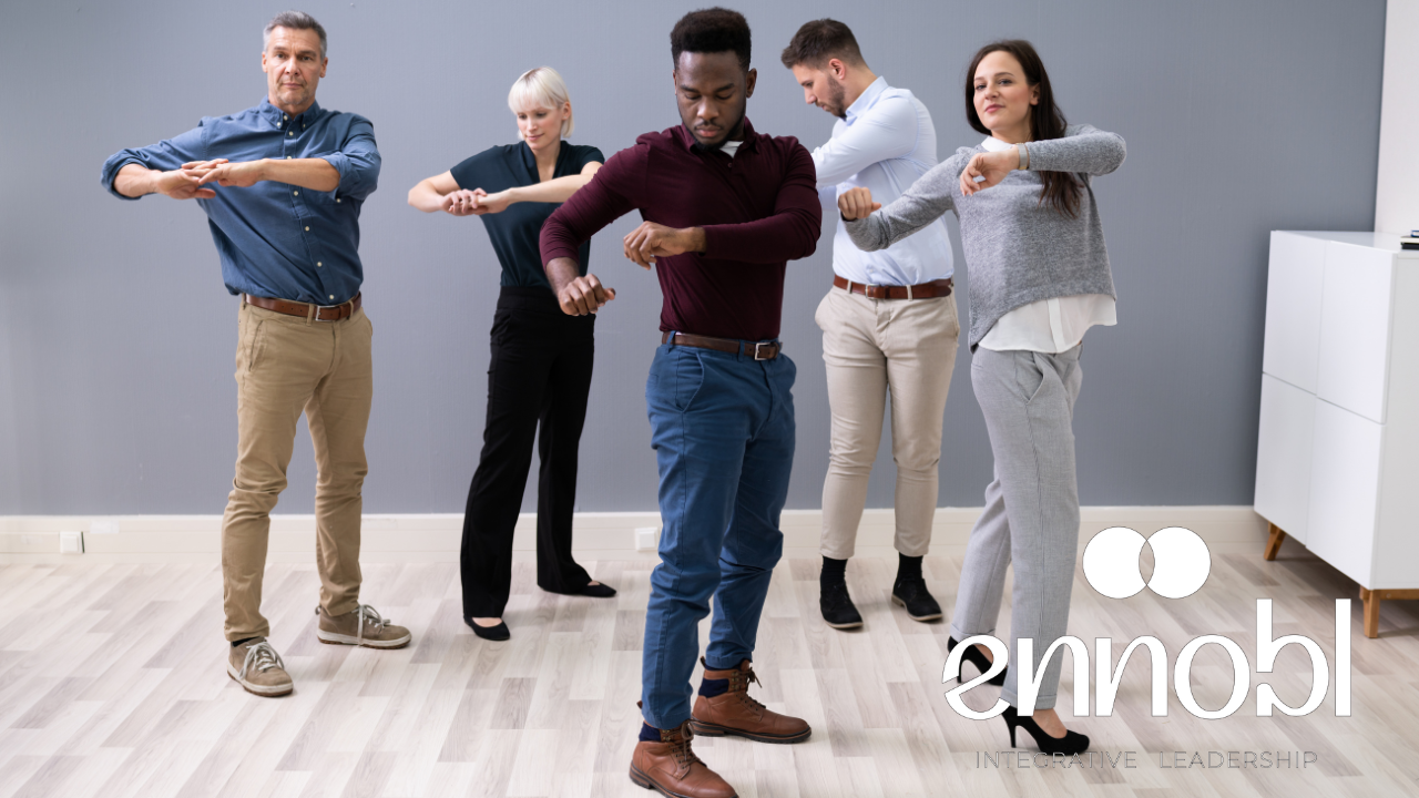Group of business people doing an easy movement together.
