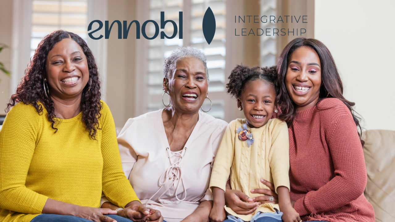 Multiple generations of women in one family smiling.