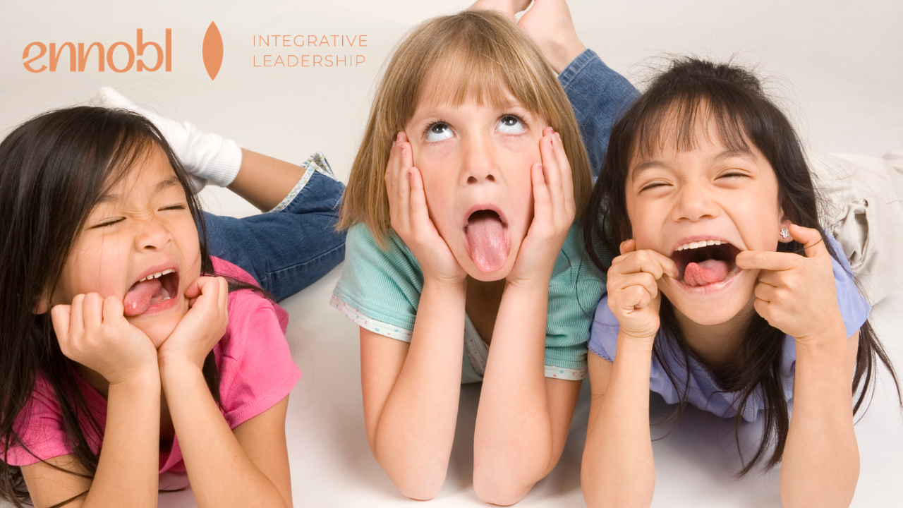 Three girls making silly faces together.