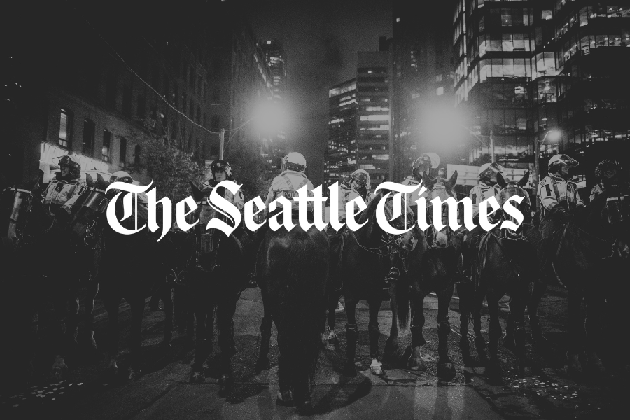 Seattle Times logo with photo of police on horseback, illustrating Sam Pailca’s op-ed on public safety and policing.