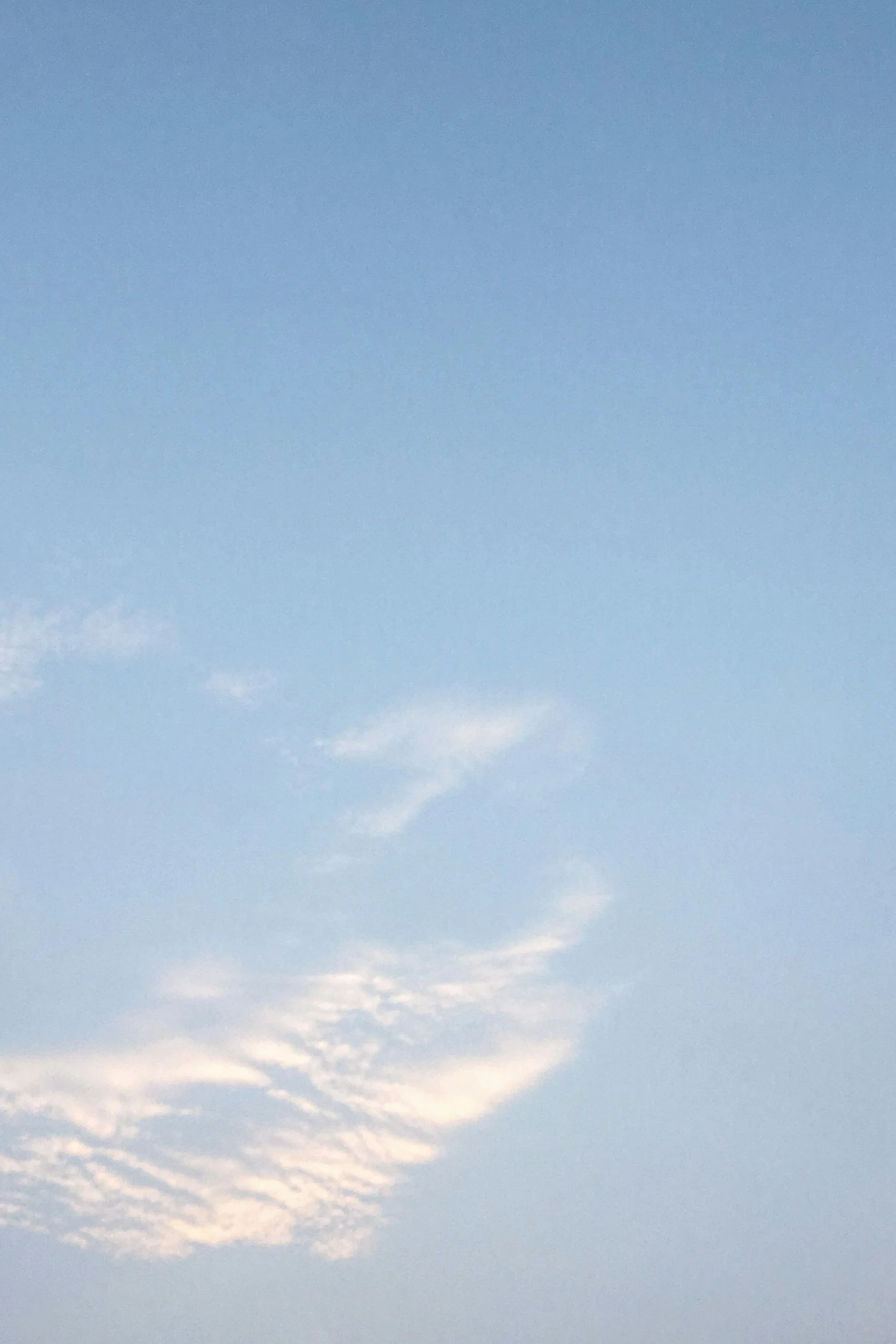 blue sky with wispy clouds