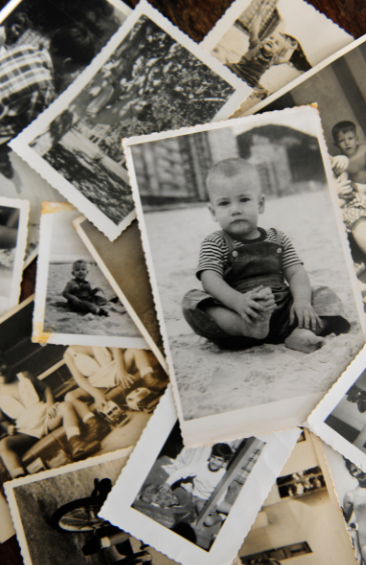 A collection of vintage black-and-white photographs featuring children and outdoor scenes.