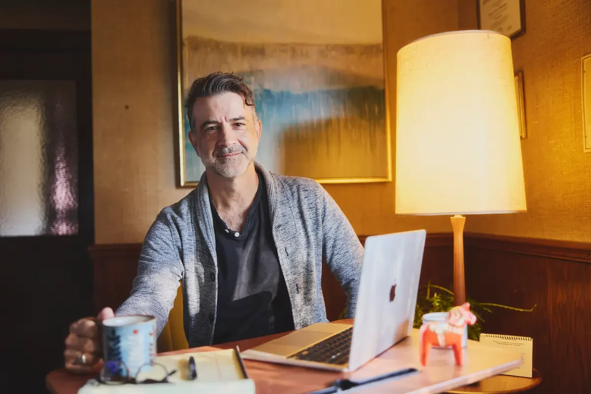 Therapist at computer working with men's issues