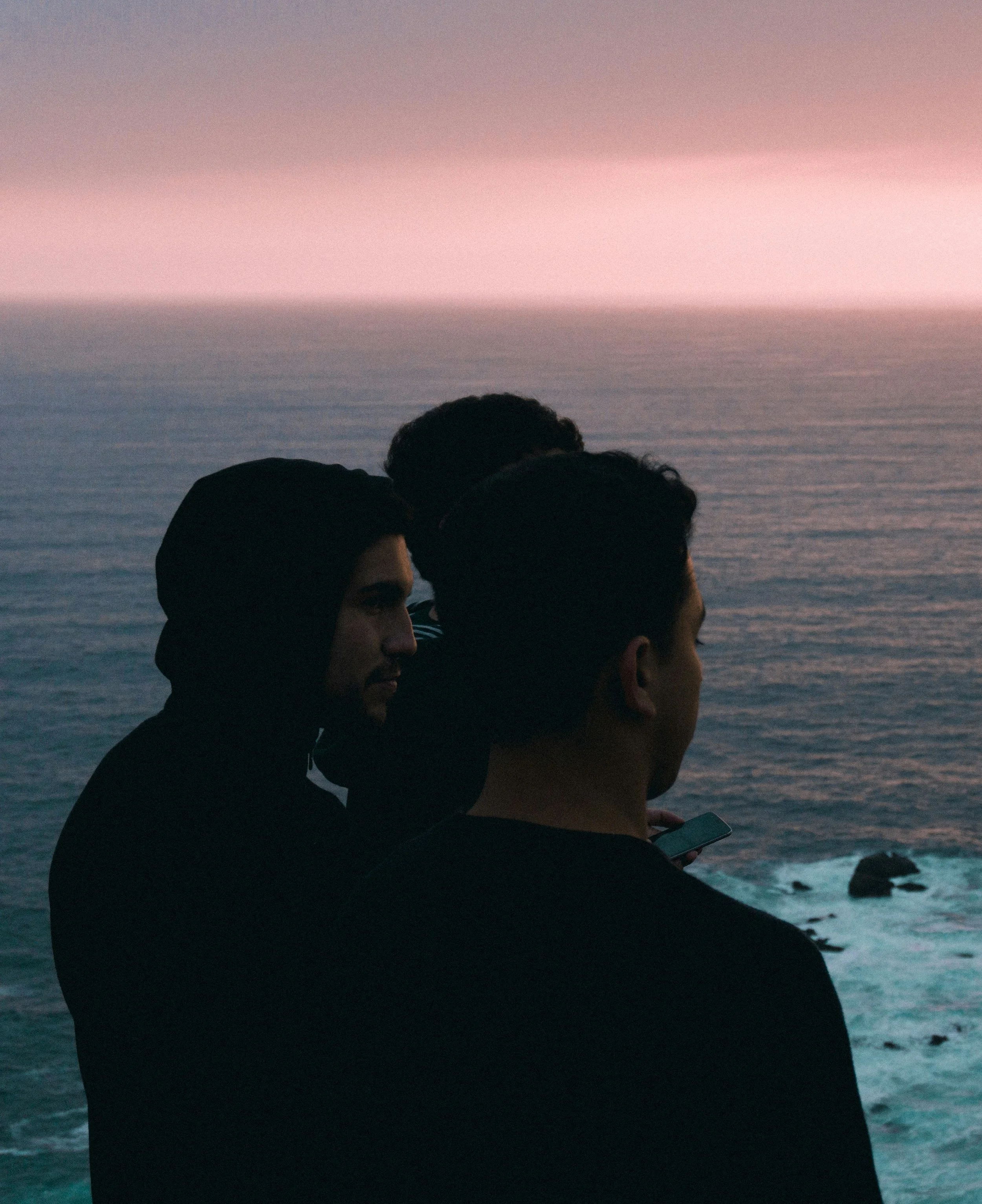 glasses coffee mug and candle on desk by green wall