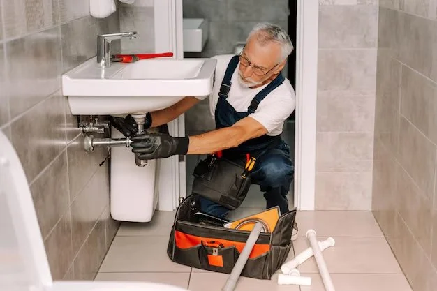 senior-plumber-installing-sink-bathroom_695242-20236.jpeg