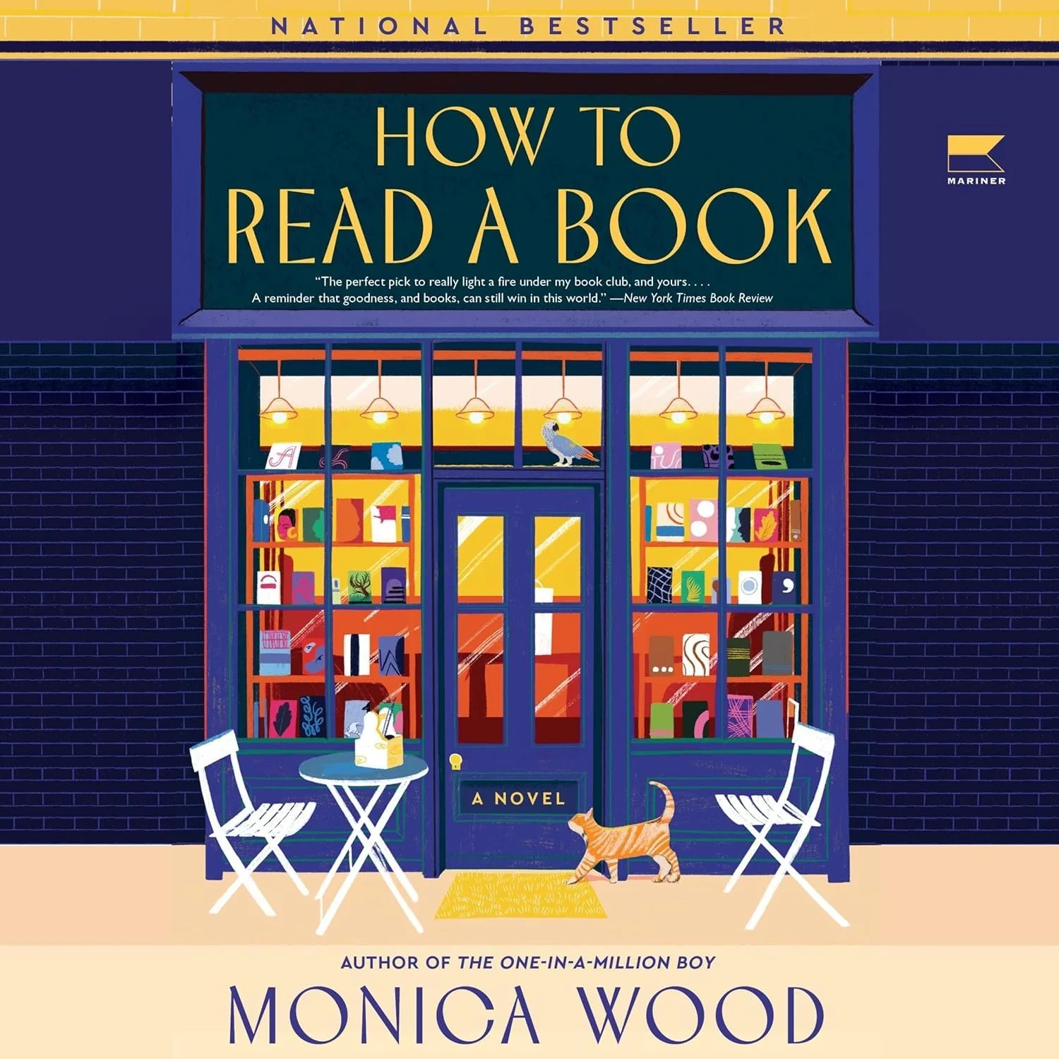 Book cover of 'How to Read a Book' by Monica Wood, featuring an illustration of a bookstore with large windows, two white chairs and a table outside, a cat walking, and a bird sitting on the window ledge, with a dark brick building and a yellow sign.