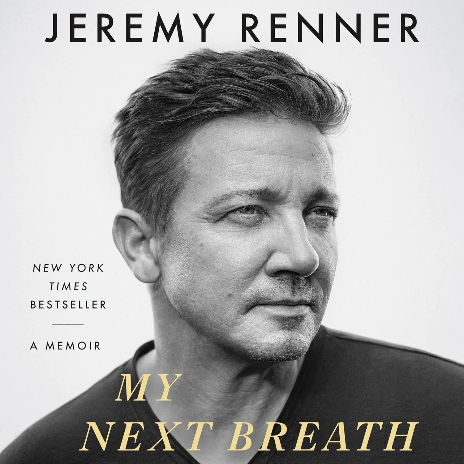 Book cover featuring a black and white close-up of actor Jeremy Renner with the title "My Next Breath" in gold letters, and text indicating it is his memoir, a New York Times bestseller.