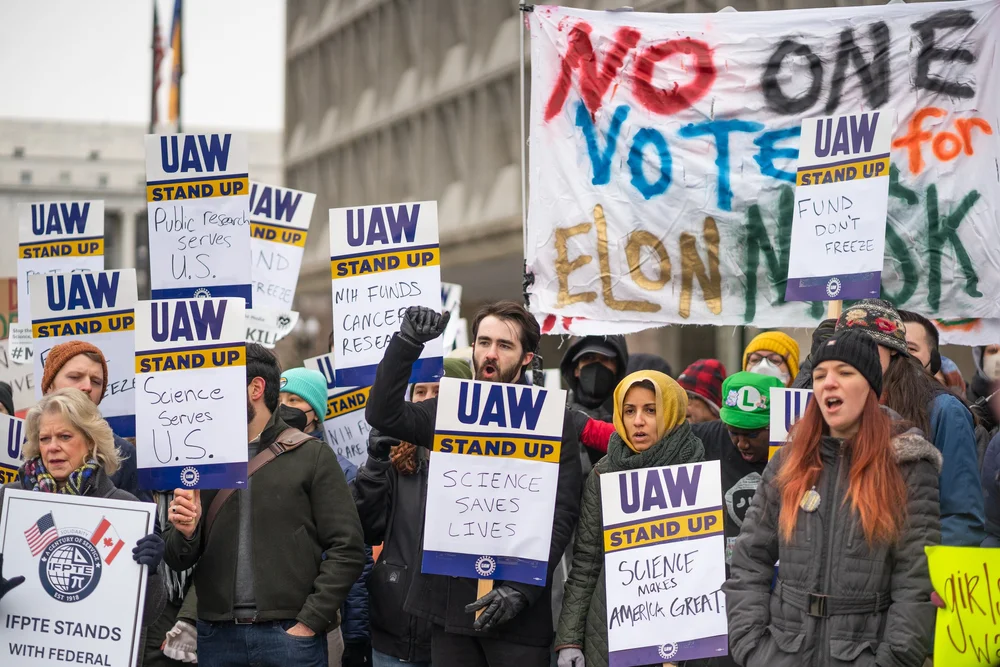 UAW 2750 members picketing outside HHS to defend research jobs