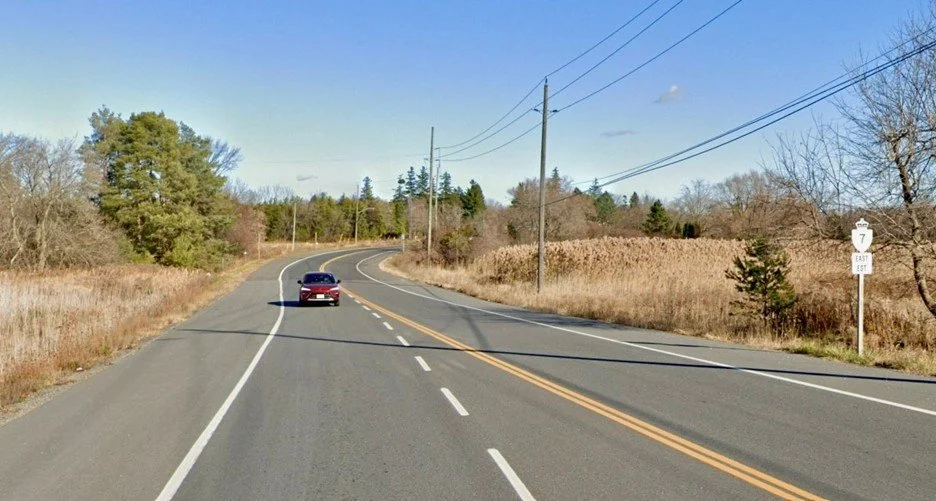 Photo of car driving on a stretch of Highway 7.