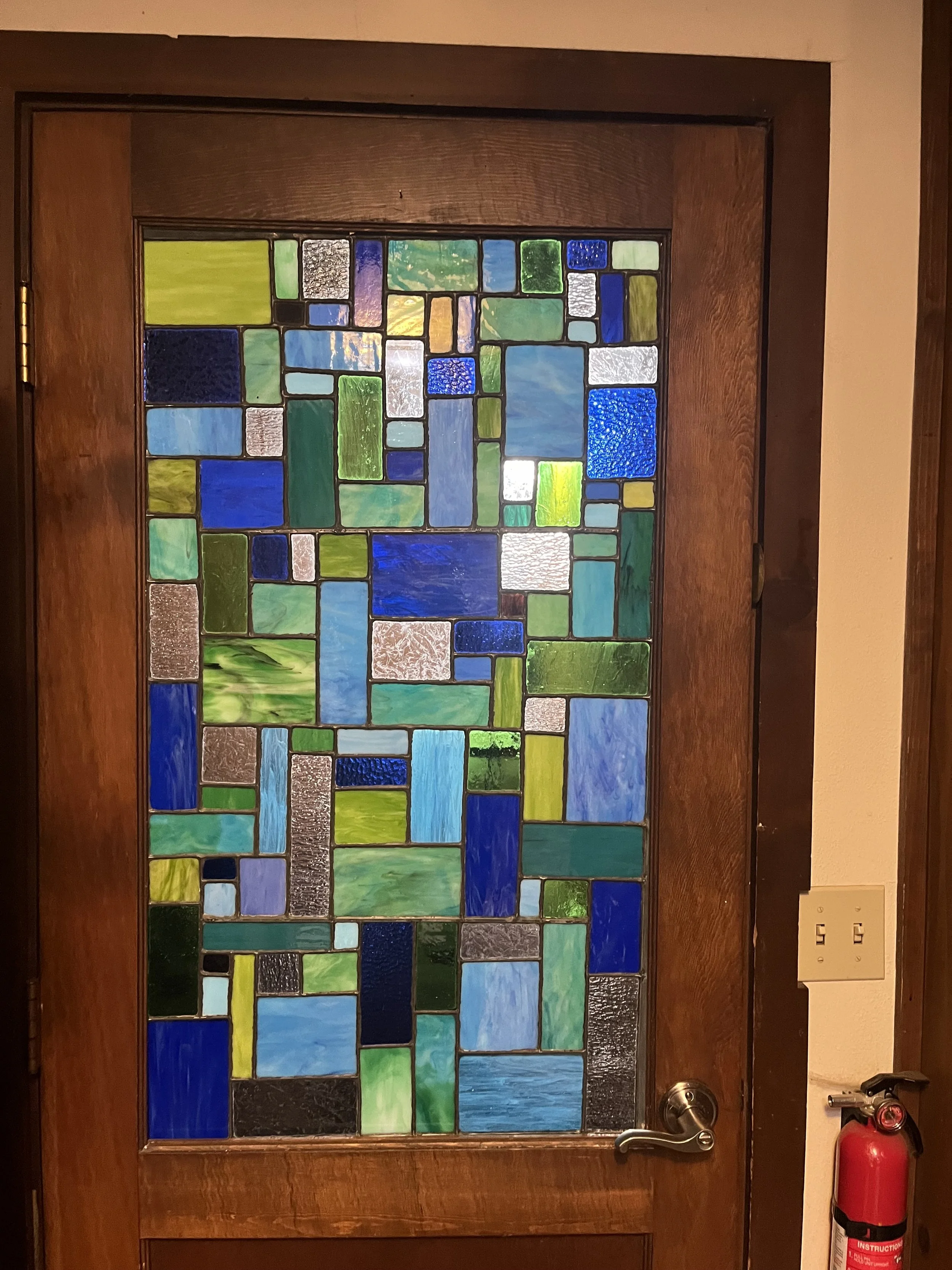 Custom commission for abstract window in an external-opening kitchen door