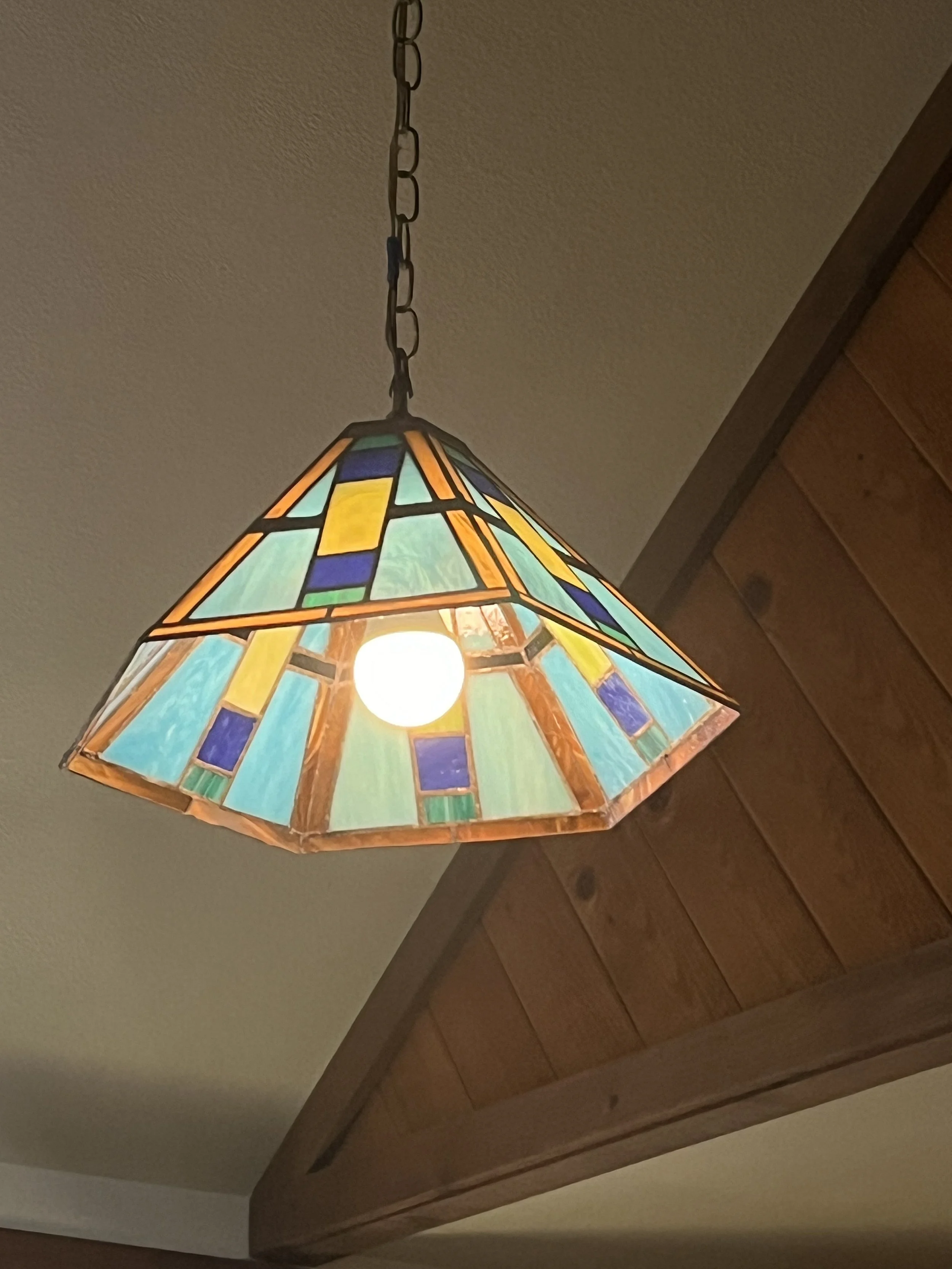Custom commission for a set of 2 geometric stained glass lamps with matching sconces for a home in California