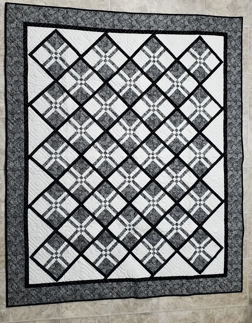 Disappearing Nine Patch 59" x 71"