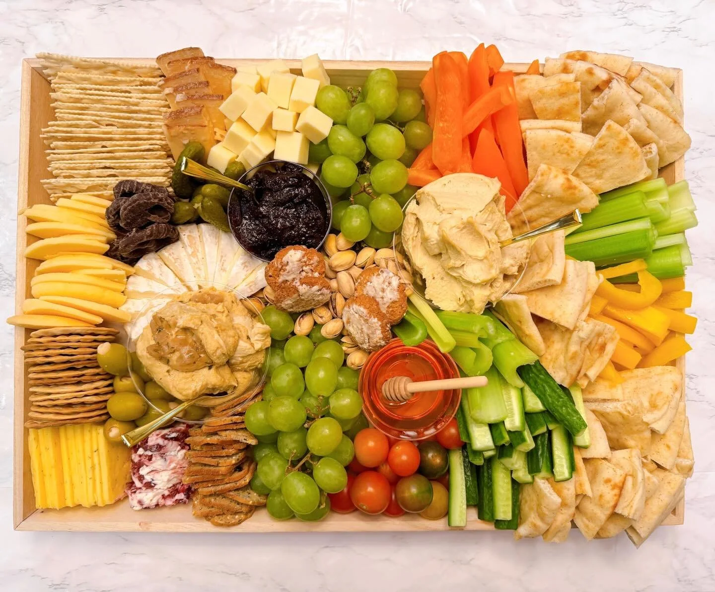 Hummus and veggies ✔️ cheese and crackers ✔️ a little something for everyone 🥕🧀🍇