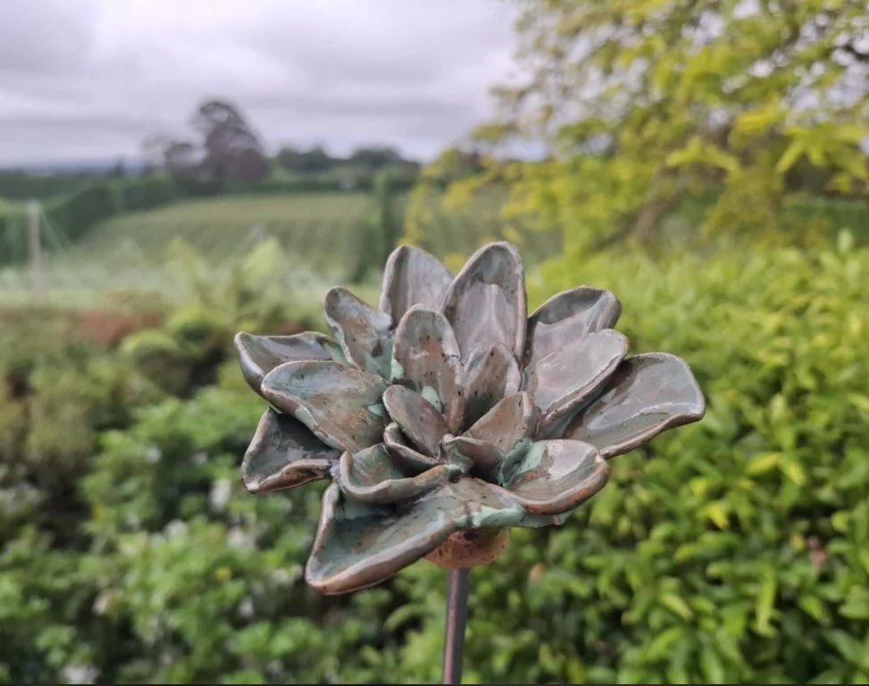 Speckled green medium flower on stake.jpg