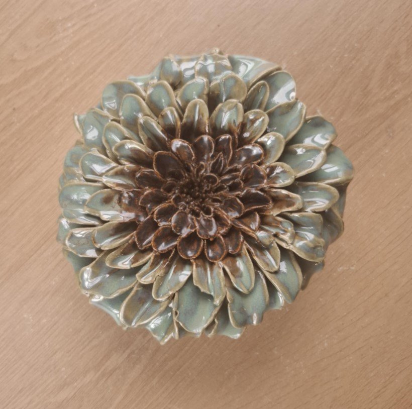 Textured turquoise dahlia with ancient copper centre