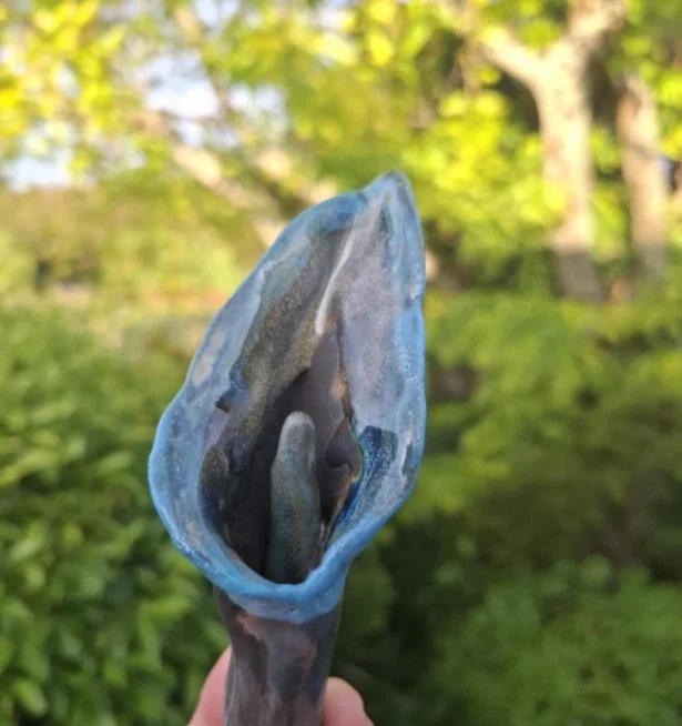 Calla Lily in black clay with light blue.jpg