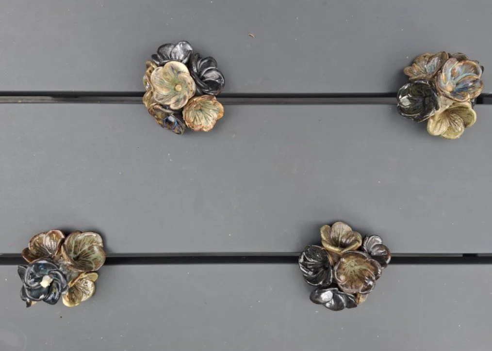 Small ceramic flower bunches on bench.jpg