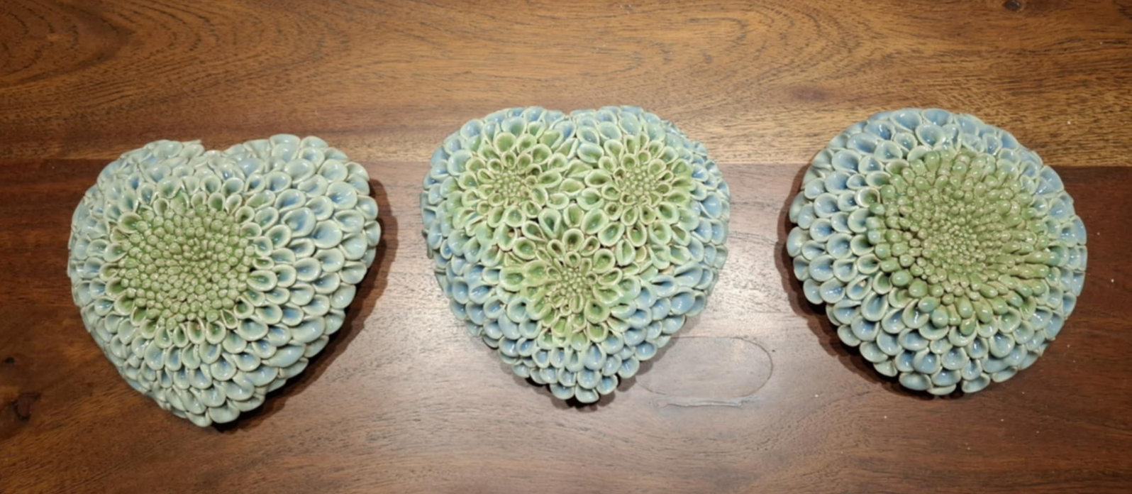 Blue and green set of 3 dahlias on table.png