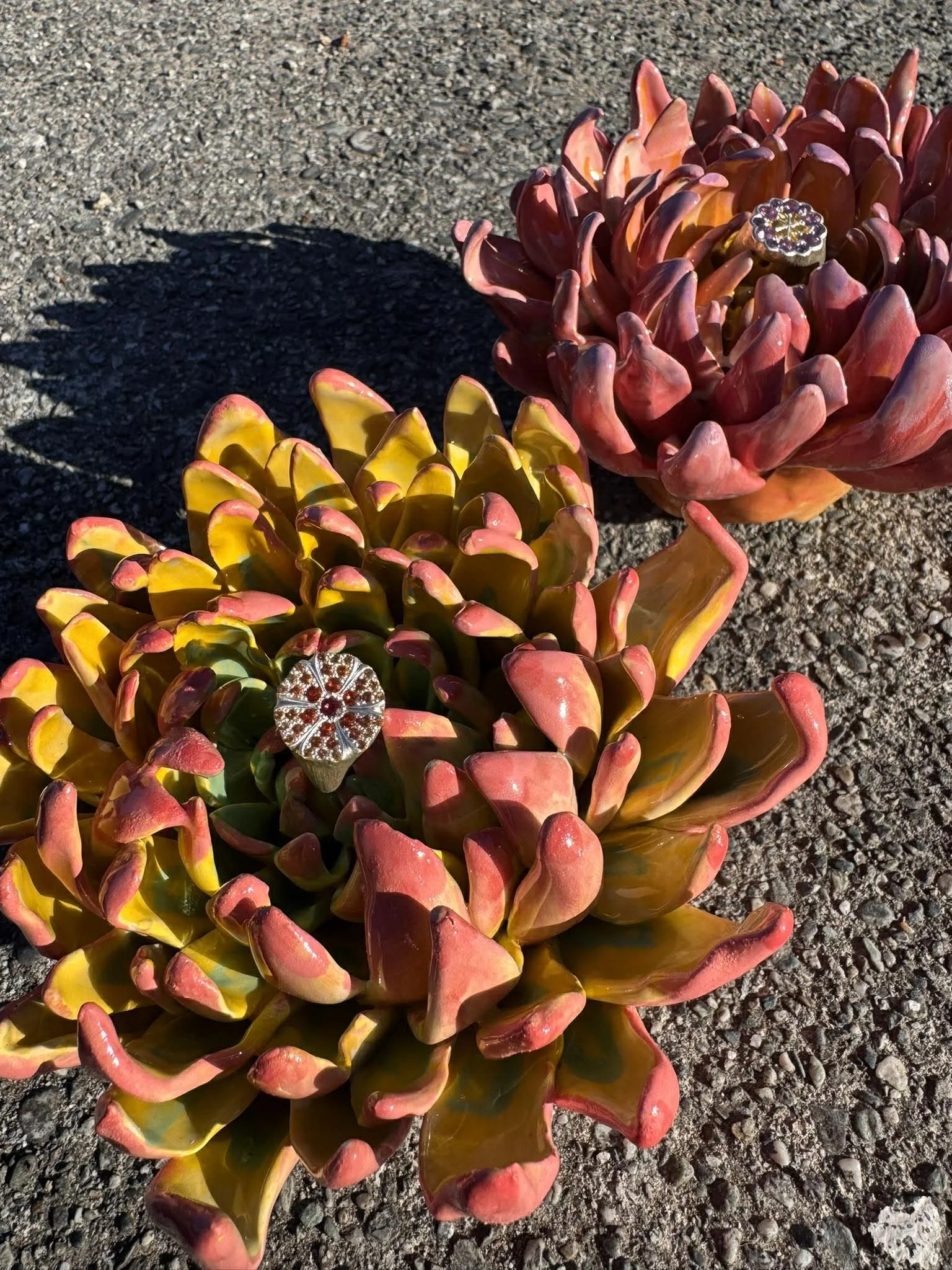 Beautiful bright spikey dahlia pottery flowers displaying unique gemstone rings ring NZ artist Adele Stewart Maker. Ceramic Flowers made for life!
