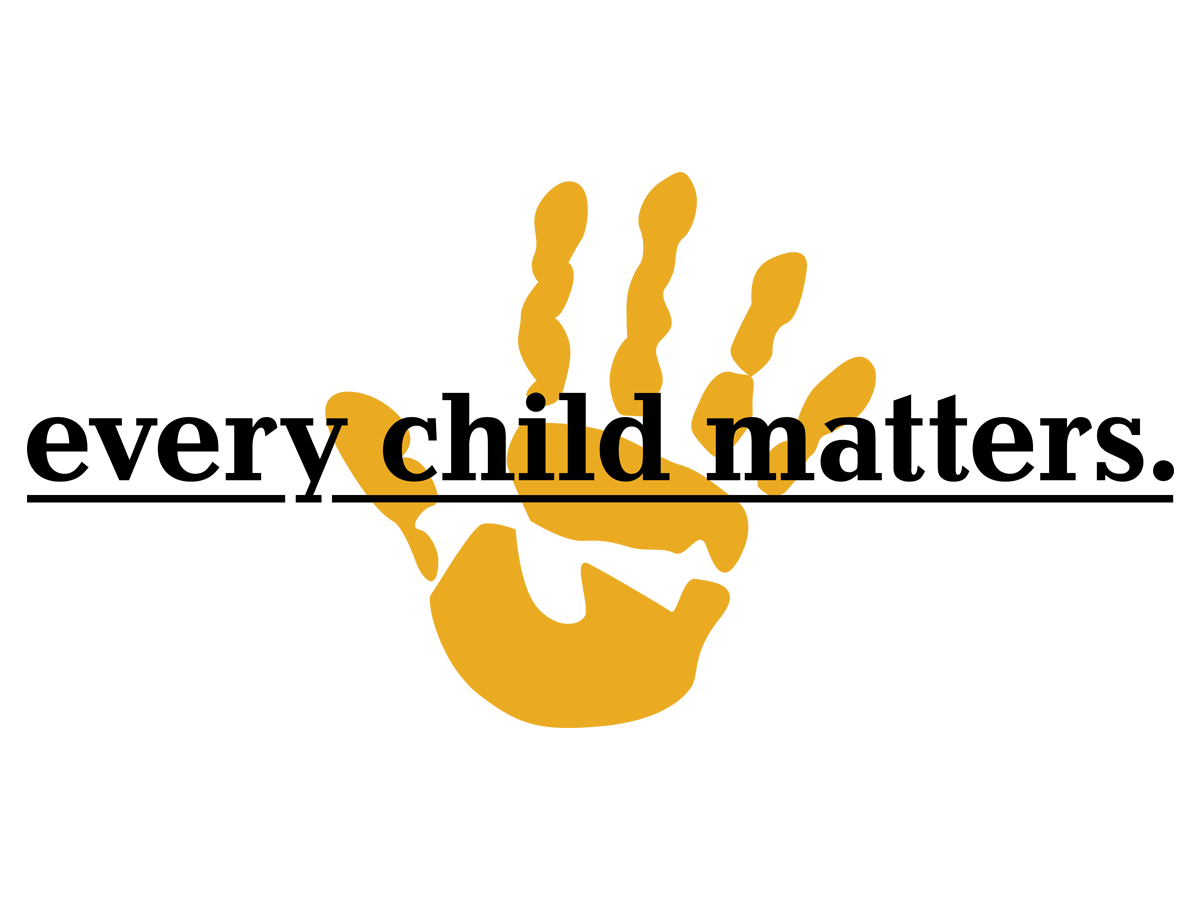 Black circular badge with gold text and a gold fist in the center. The text says "Black Lives Matter" with "Black" at the top, "Lives" in the middle, and "Matter" at the bottom.