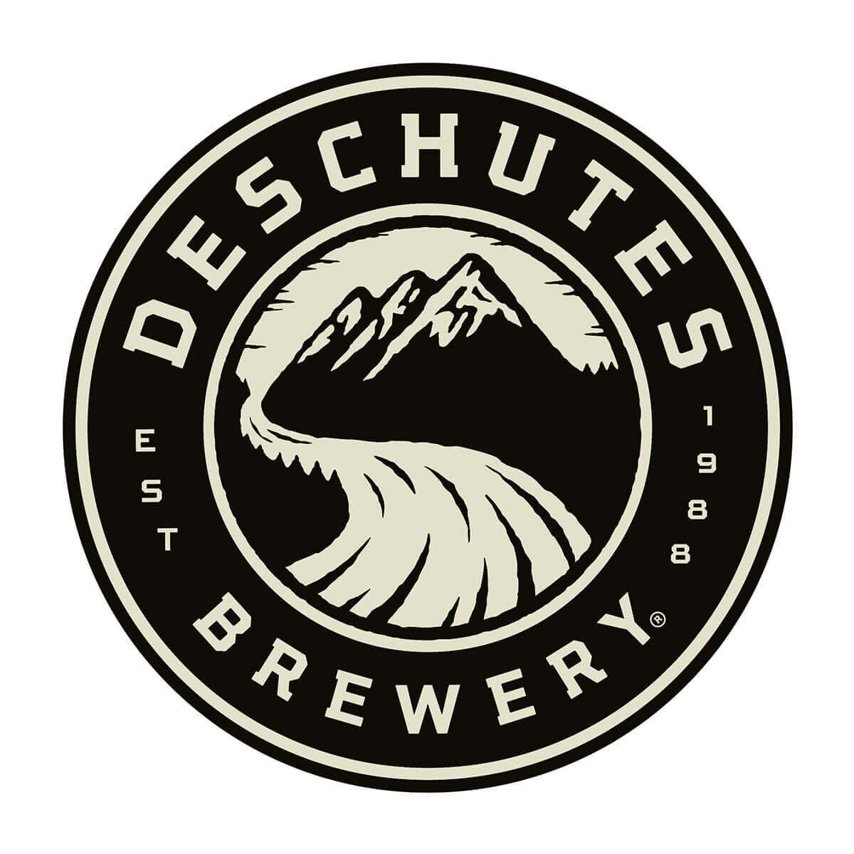A circular logo for Deschutes Brewery featuring mountains, a river, and the words "Deschutes Brewery" and "Est. 1988".
