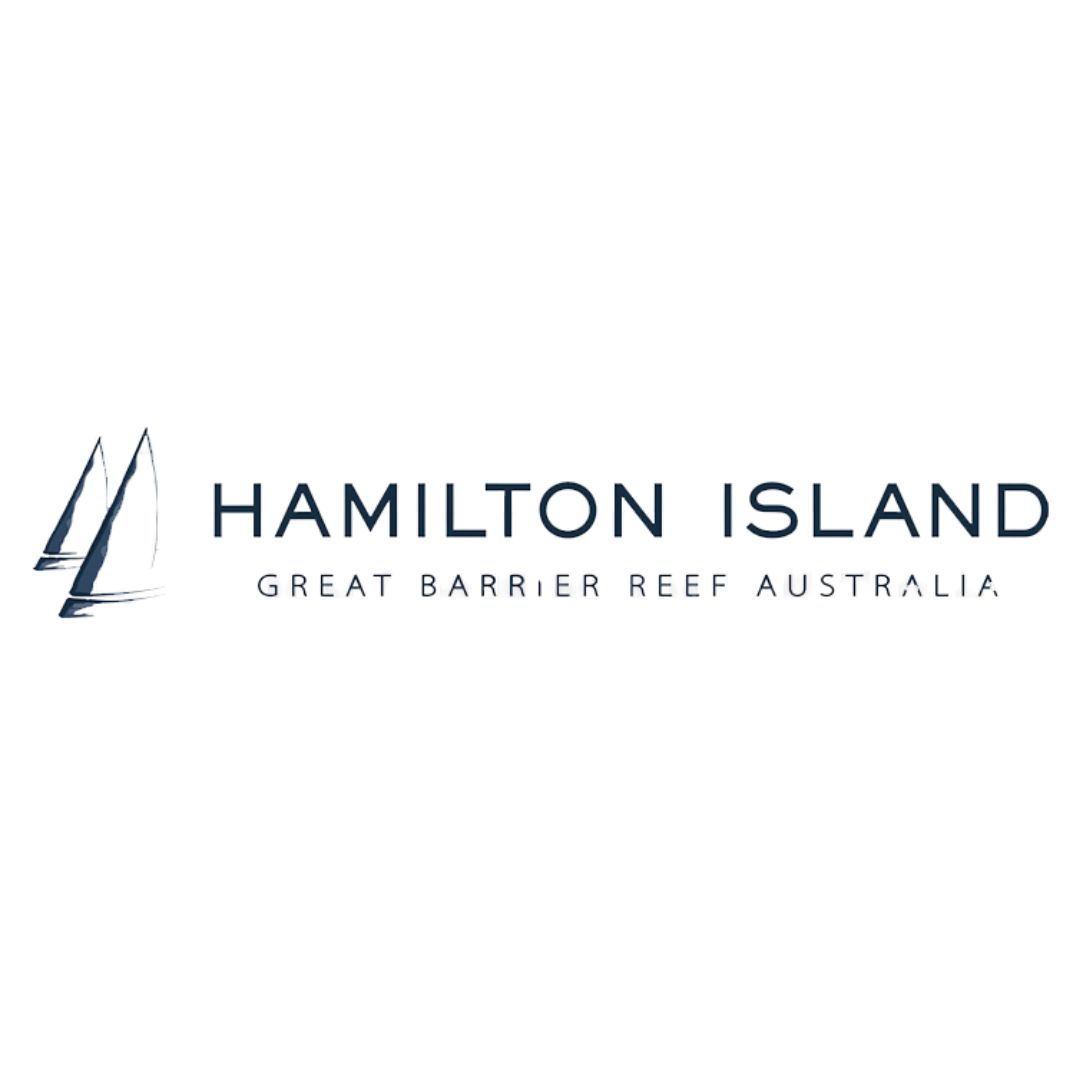 Neon sign for Hamilton Island with reflections on water at night.