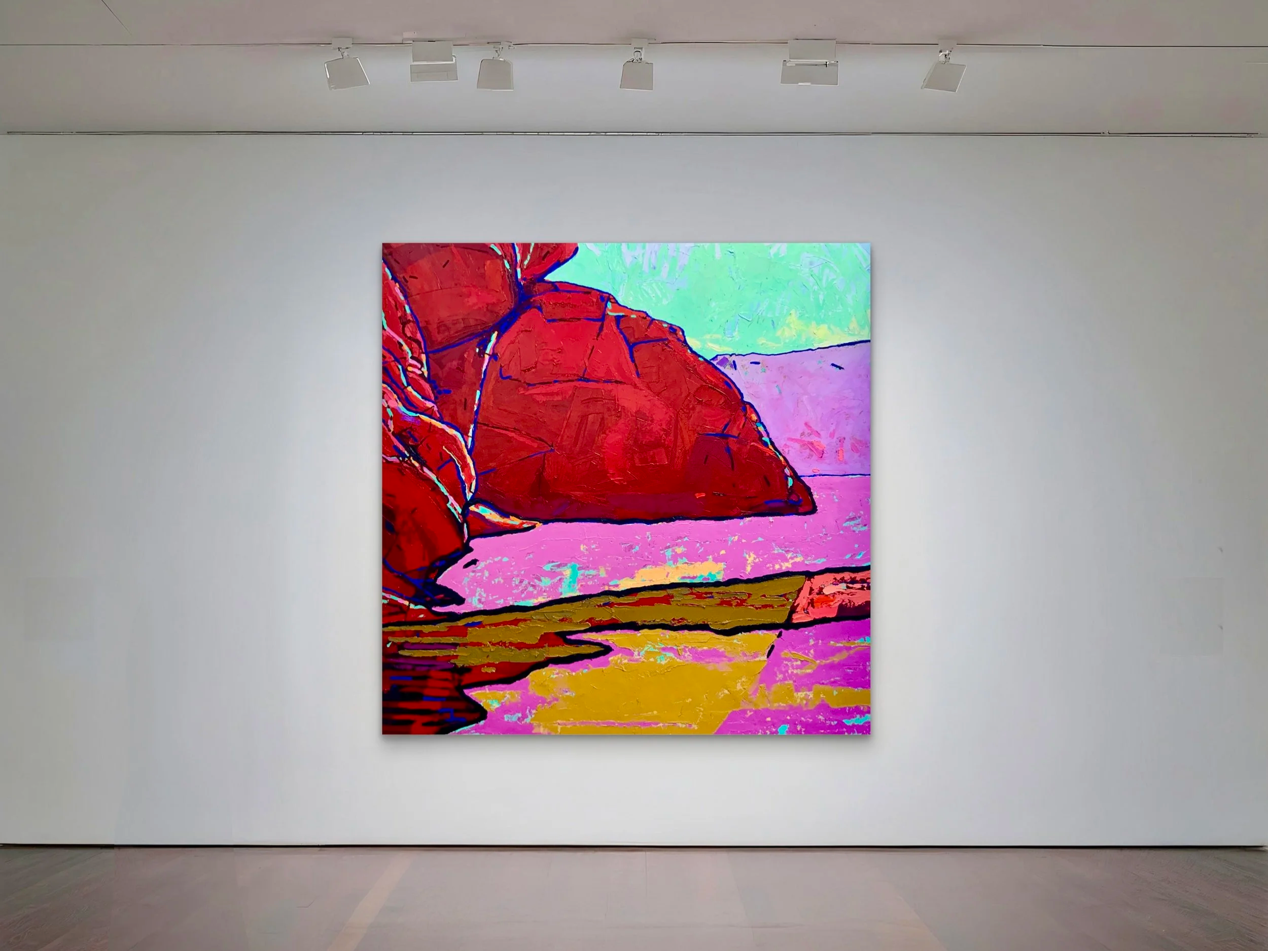 Colorful abstract painting of rocks and water in a landscape style displayed in a gallery.