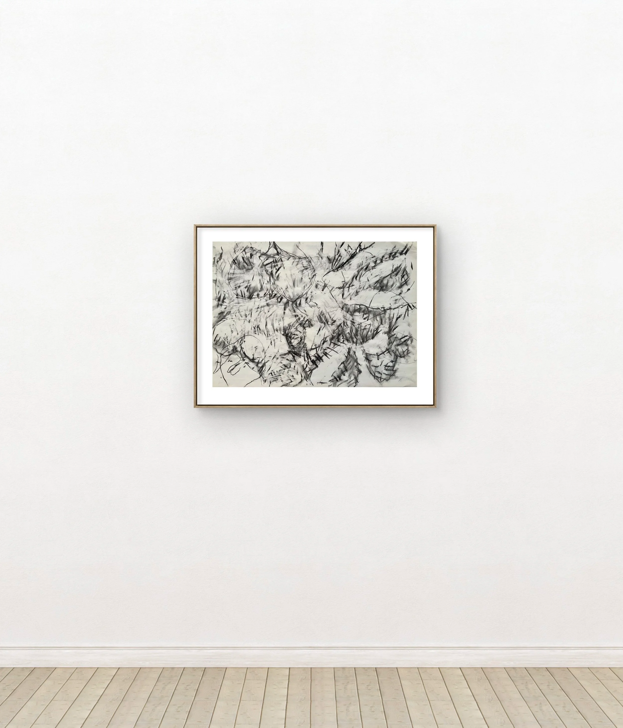 Abstract black and white drawing of leaves with expressive, sketchy lines, framed on a white wall in a gallery setting.