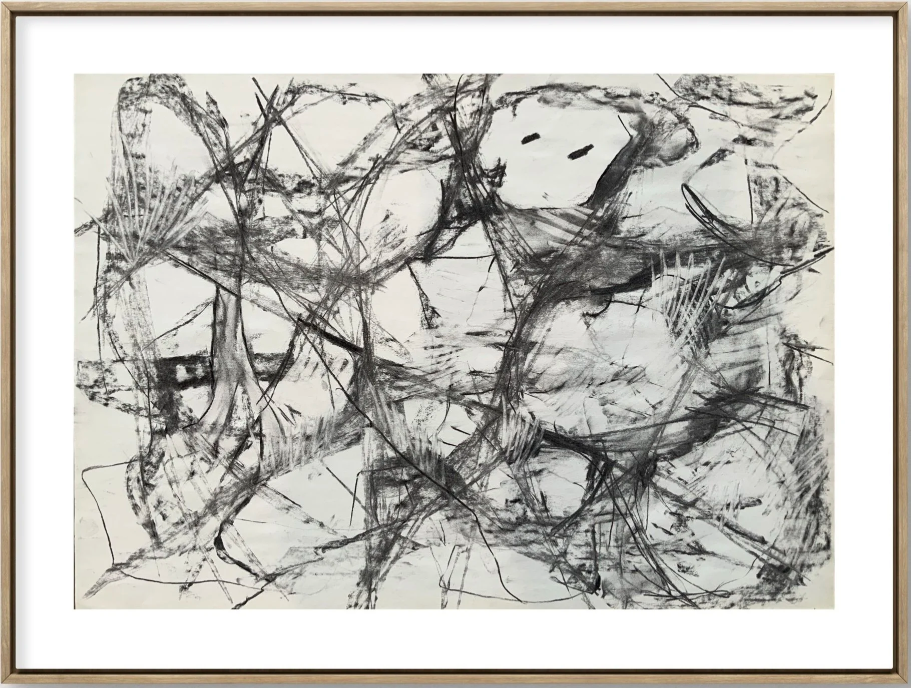Black and white abstract drawing with various lines, shapes, and scribbles, including a face with two eyes and a mouth.