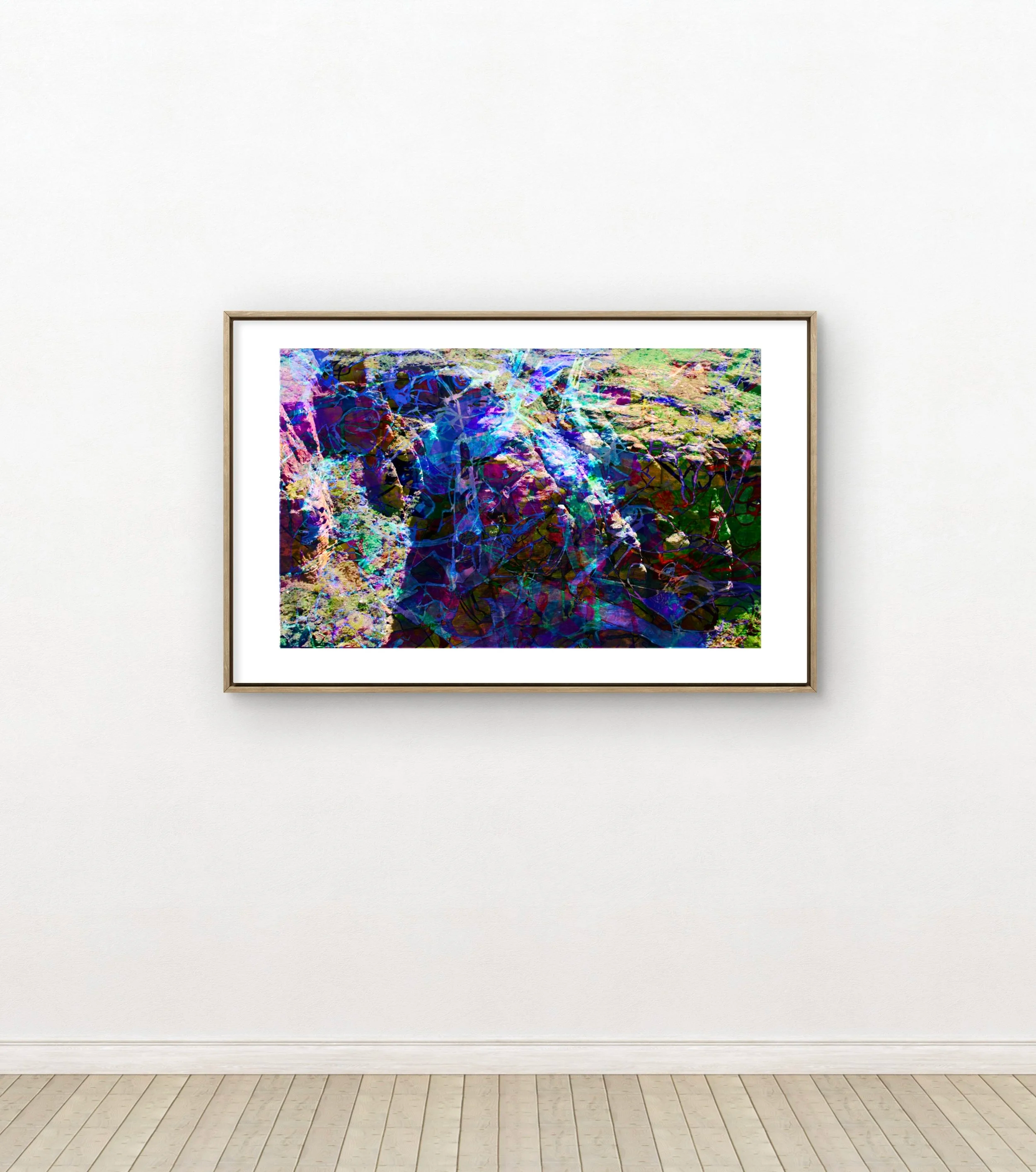 An abstract colorful painting with various shades of blue, purple, pink, and green, framed and hanging on a white gallery wall.