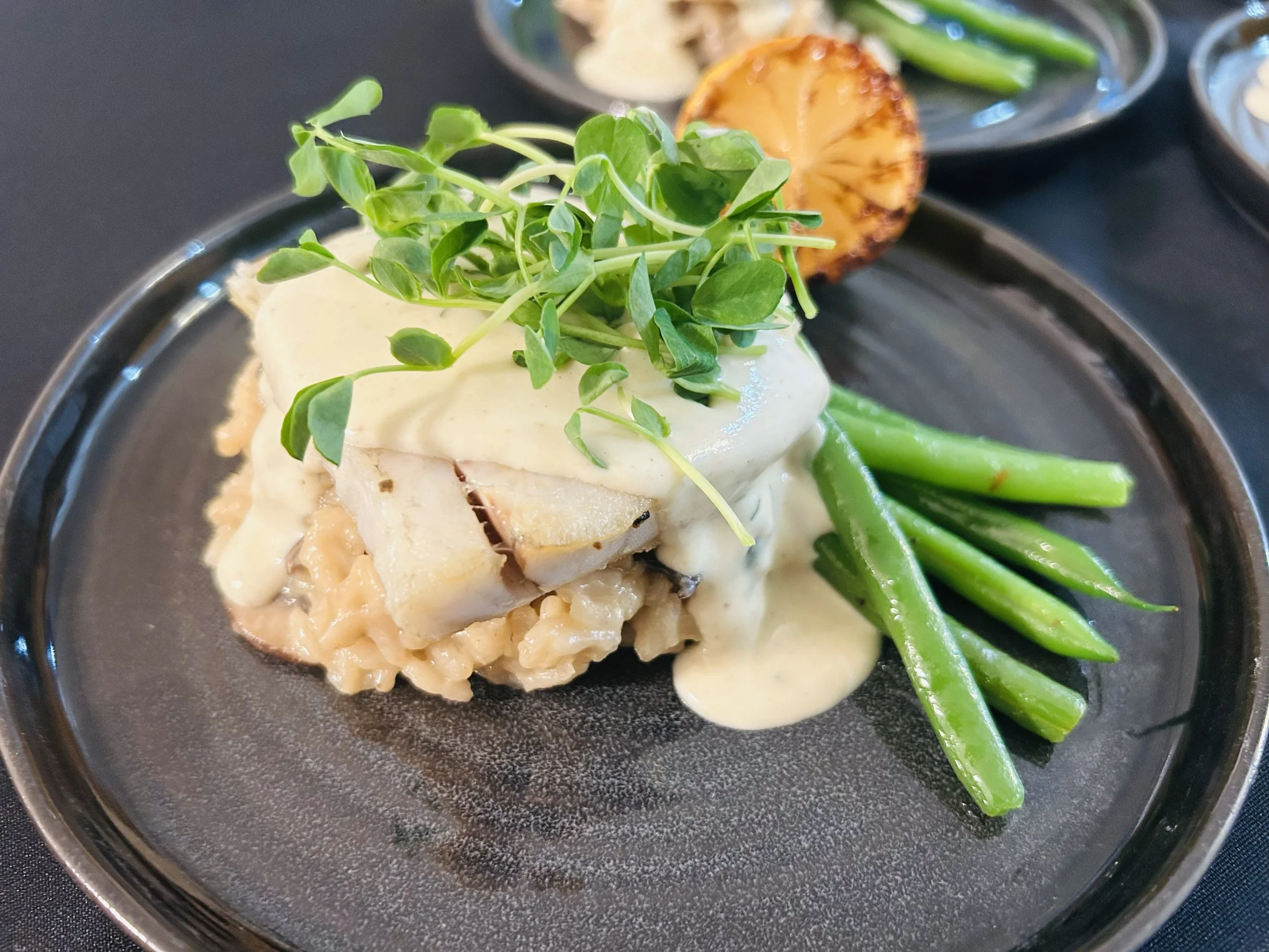 Barramundi, Mushroom Risotto, Haricot Verts, Dijon and Bone Marrow emulsion, Tarragon, Pea sprouts, Charred Lemon.
