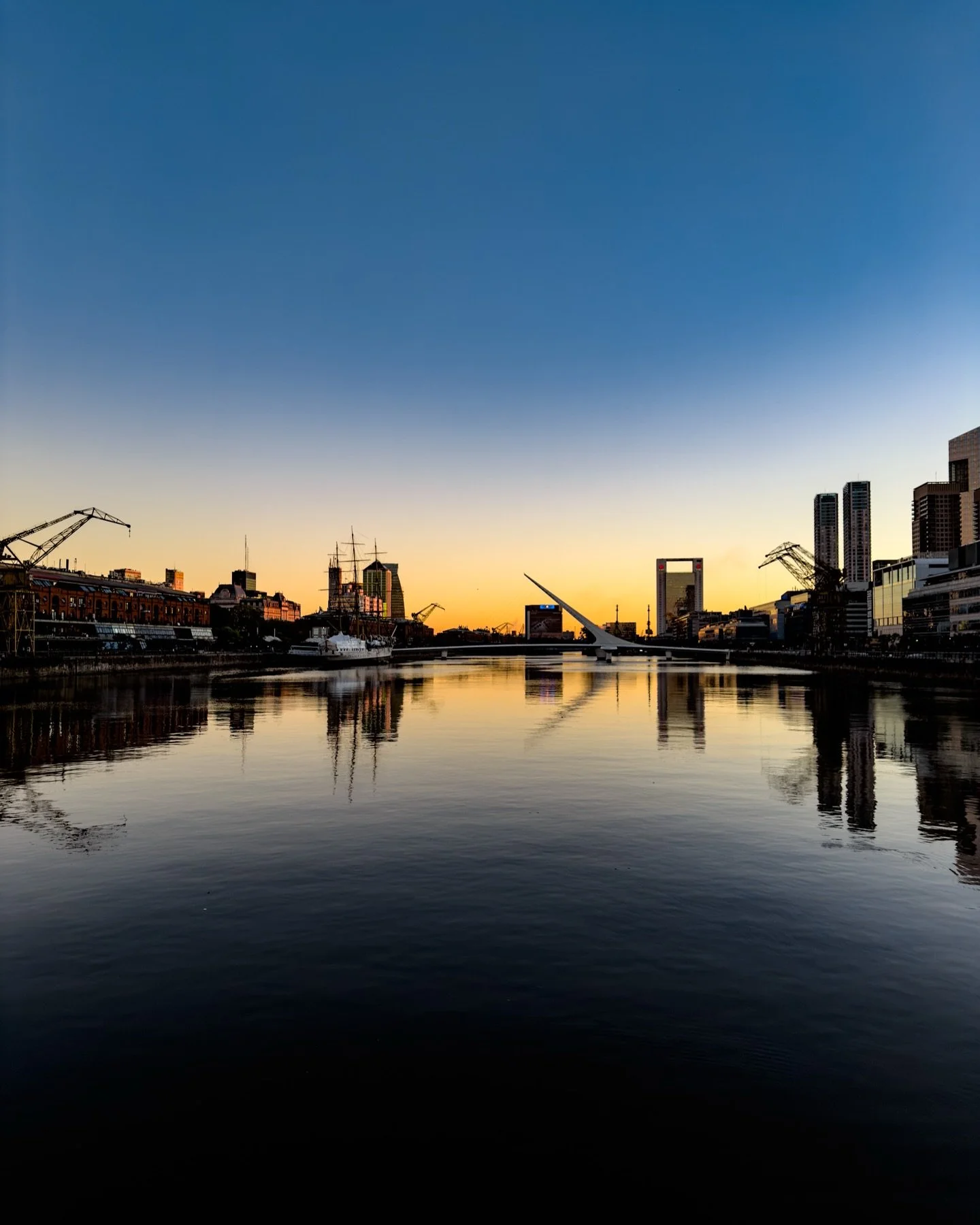 Sunrise in Puerto Madero, Buenos Aires &mdash; my first time in Argentina 🇦🇷 and in South America.

I was up this early thanks to jet lag, but it turned out to be the perfect timing to watch the city wake up.
The sun hadn&rsquo;t quite risen yet, j