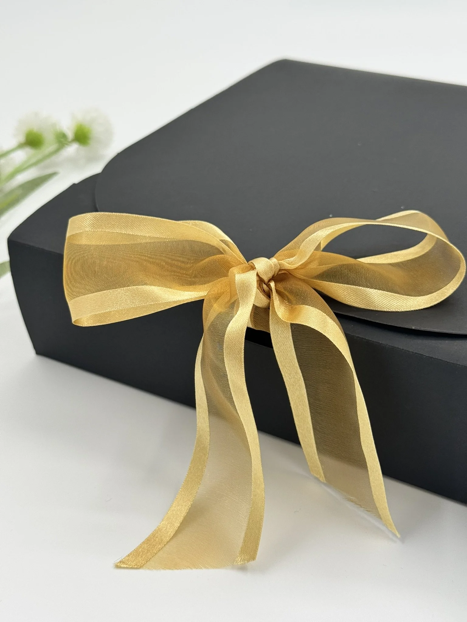 Homecoming Boy - Black Box Gold Ribbon Close up.JPEG