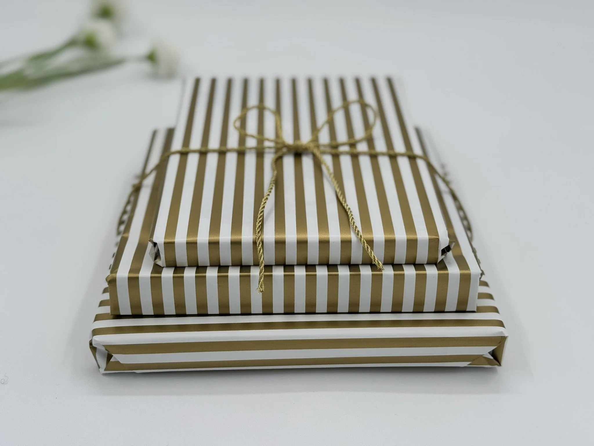 Storytime Boy - Books Wrapped Individually Stacked Straight Close Up.JPEG