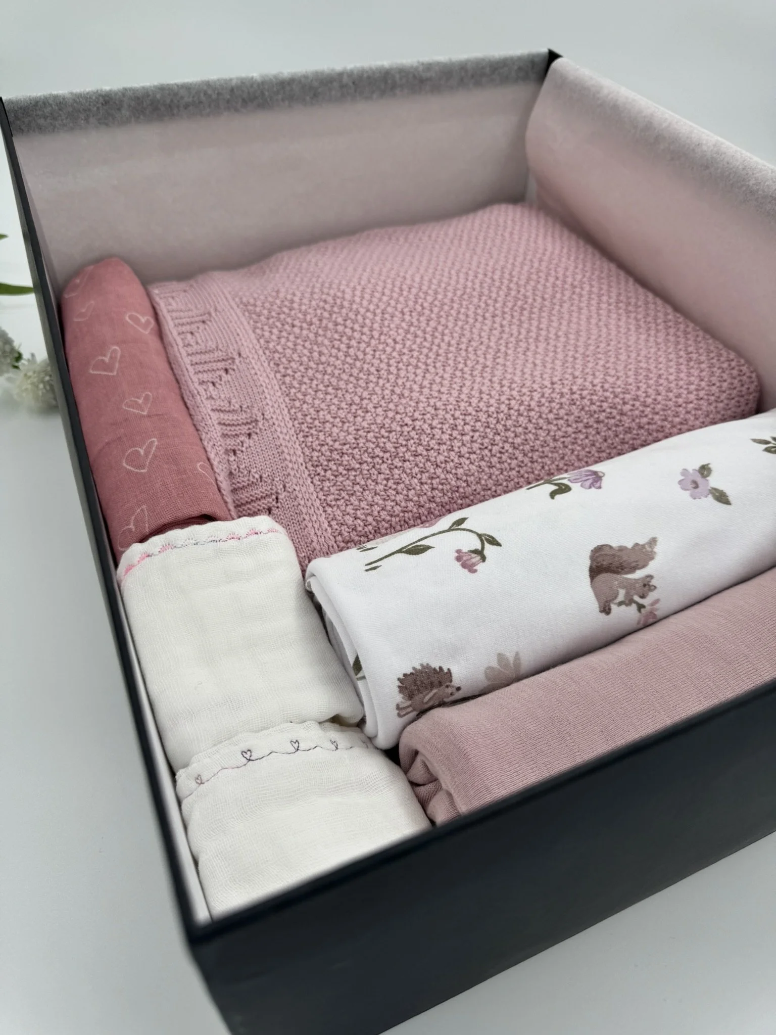 Deluxe Girl - Blanket, Merino, Cotton and Muslin Wrap, Muslin Wipes Boxed Bottom Layer Across the Top.JPEG