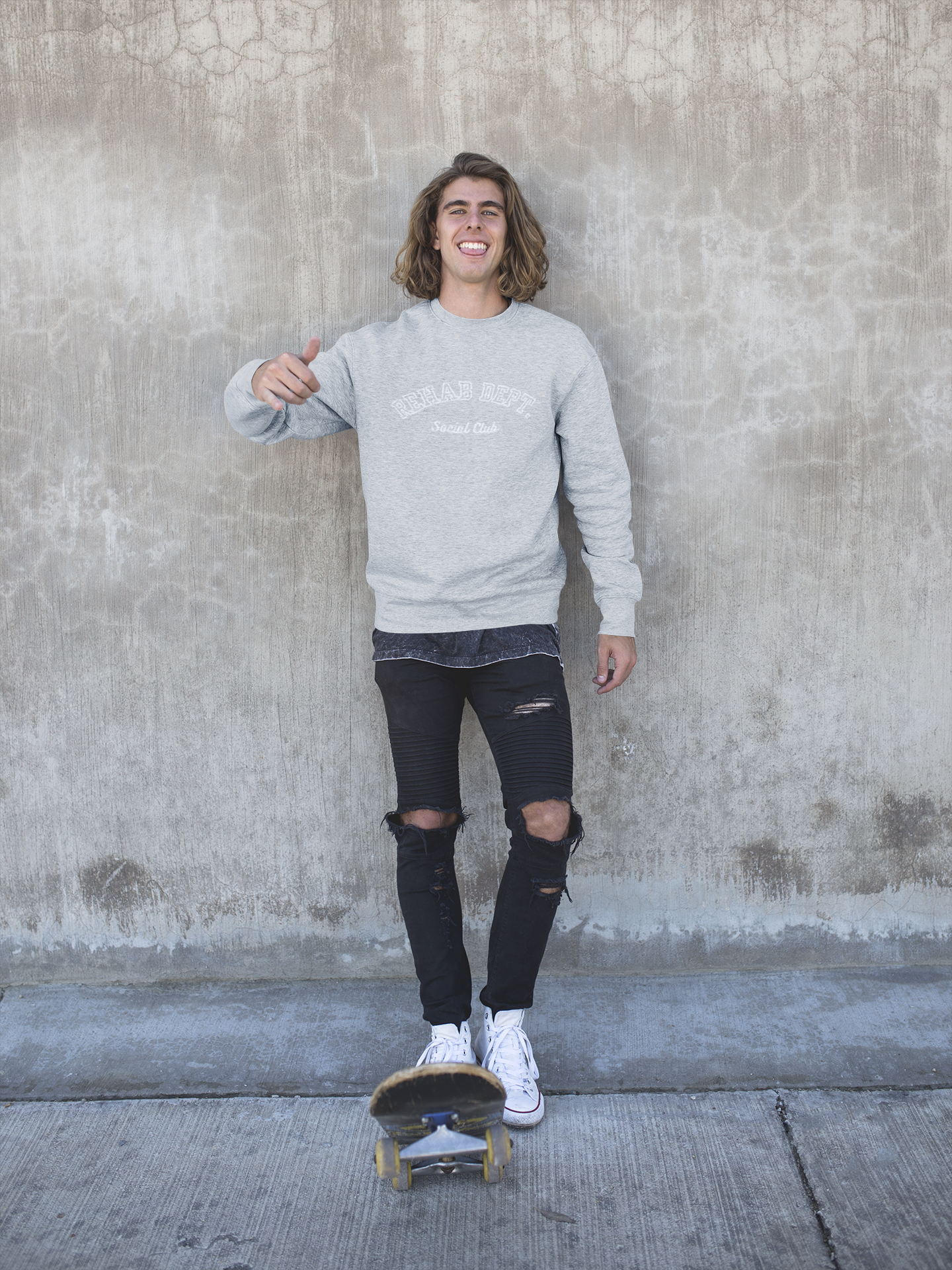 sweater-mockup-of-a-smiling-skater-man-wearing-ripped-jeans-18165.png