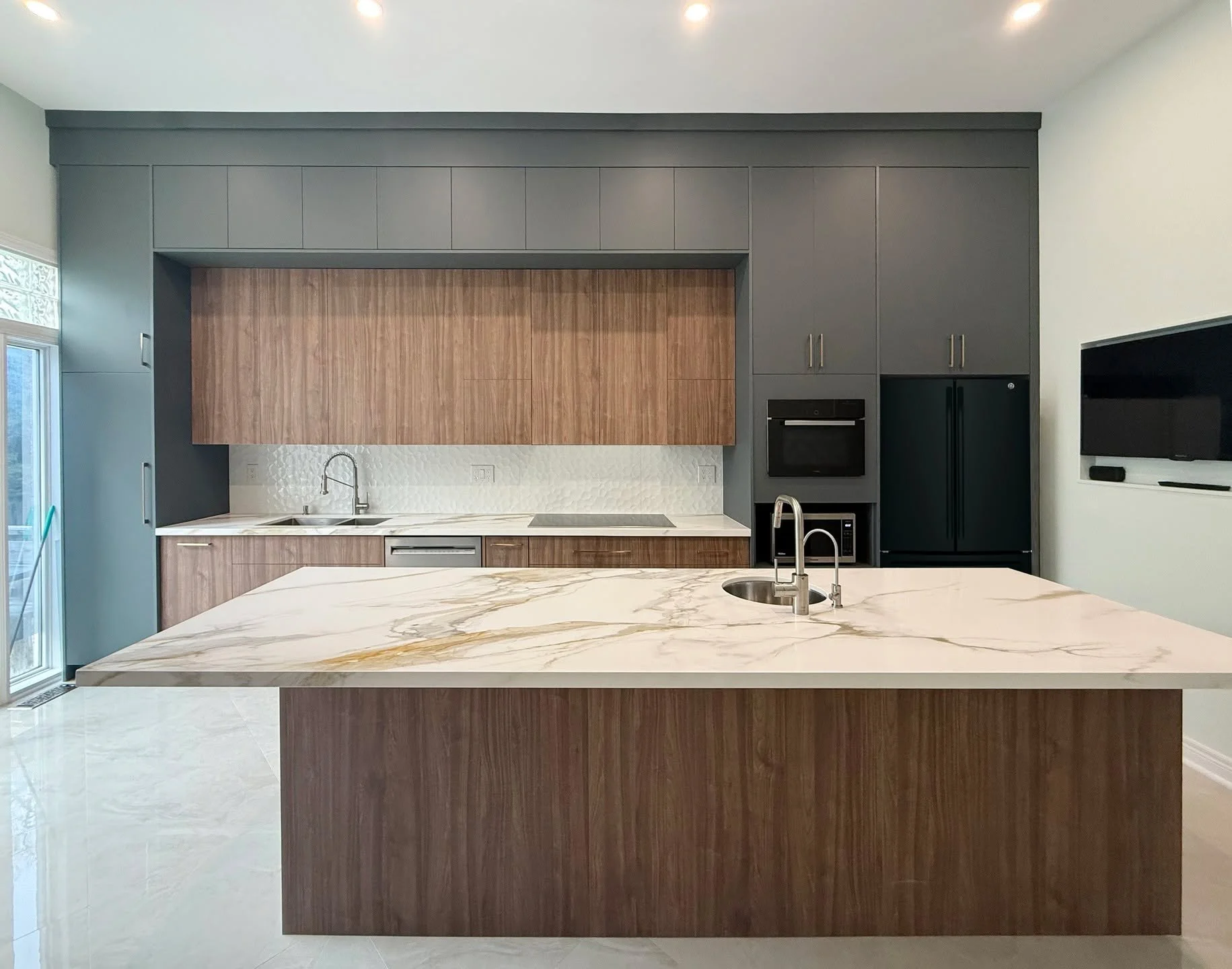A closer look at this transformation

Everything here is in the details, deep forest green cabinetry paired with warm walnut panels, brought together by a dramatic natural stone that adds contrast and movement. 

From the tones to the textures, every